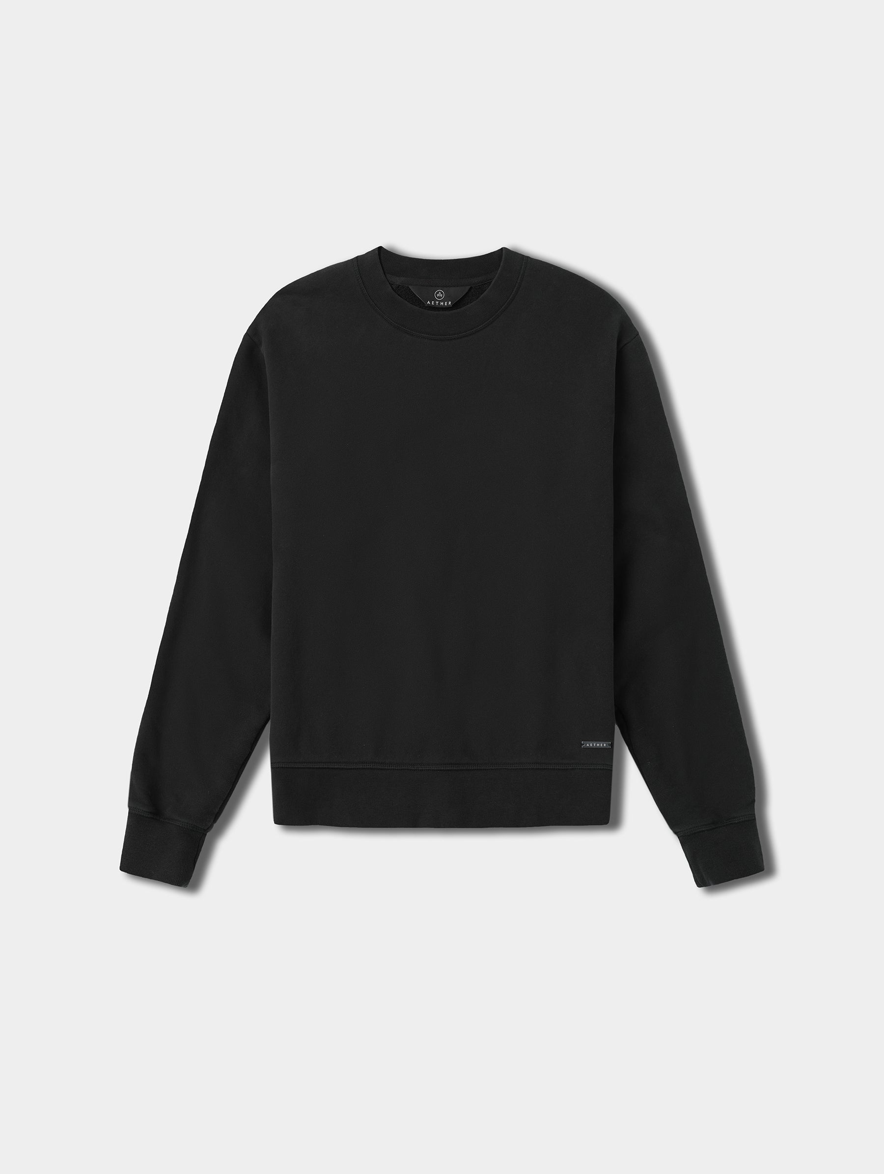 Flat lay view of the Ayla Crewneck Sweatshirt in Onyx Black from AETHER Apparel.