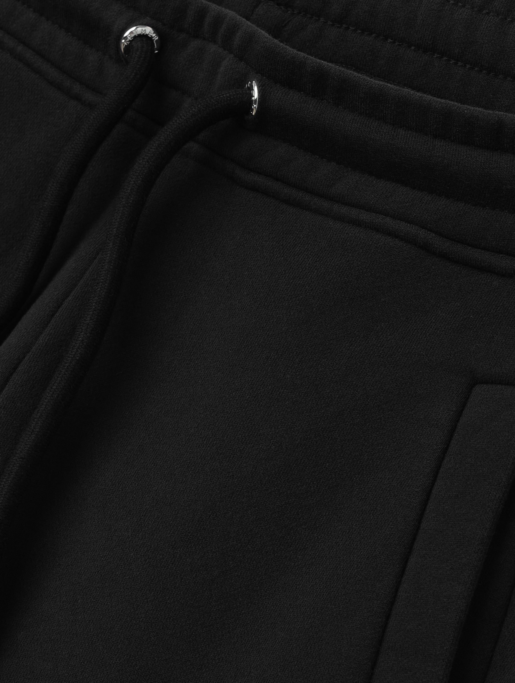Closeup detailed view of the drawstring closure on the Ayla Wide-Leg Sweatpant in Onyx Black from AETHER Apparel.