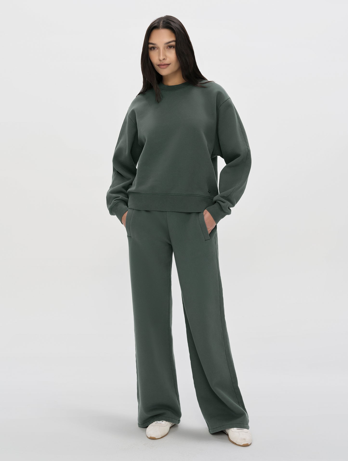 Front, full-body view of woman wearing the Ayla Wide-Leg Sweatpant in Saville Green from AETHER Apparel.