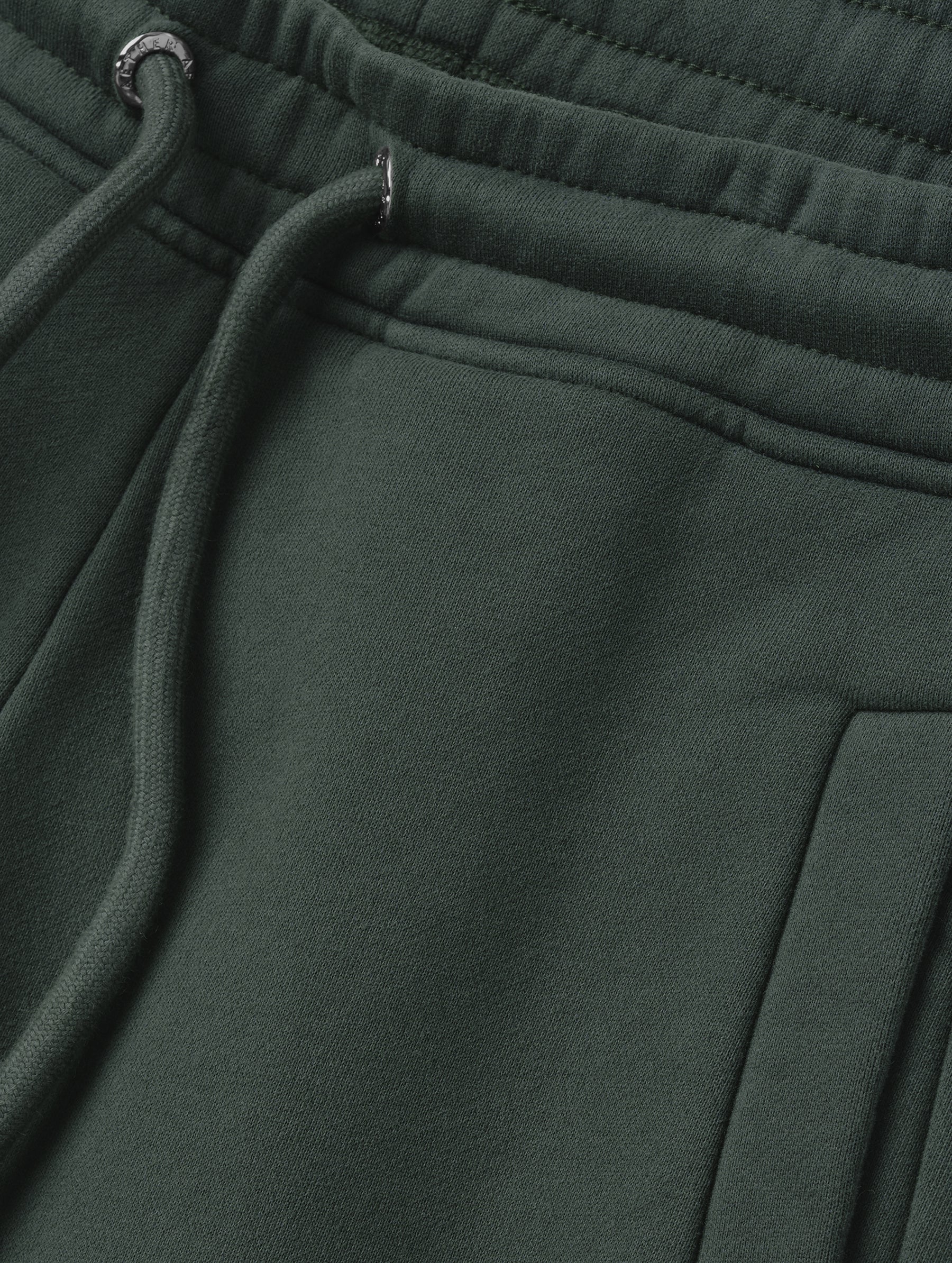 Closeup detailed view of the drawstring closure on the Ayla Wide-Leg Sweatpant in Saville Green from AETHER Apparel.
