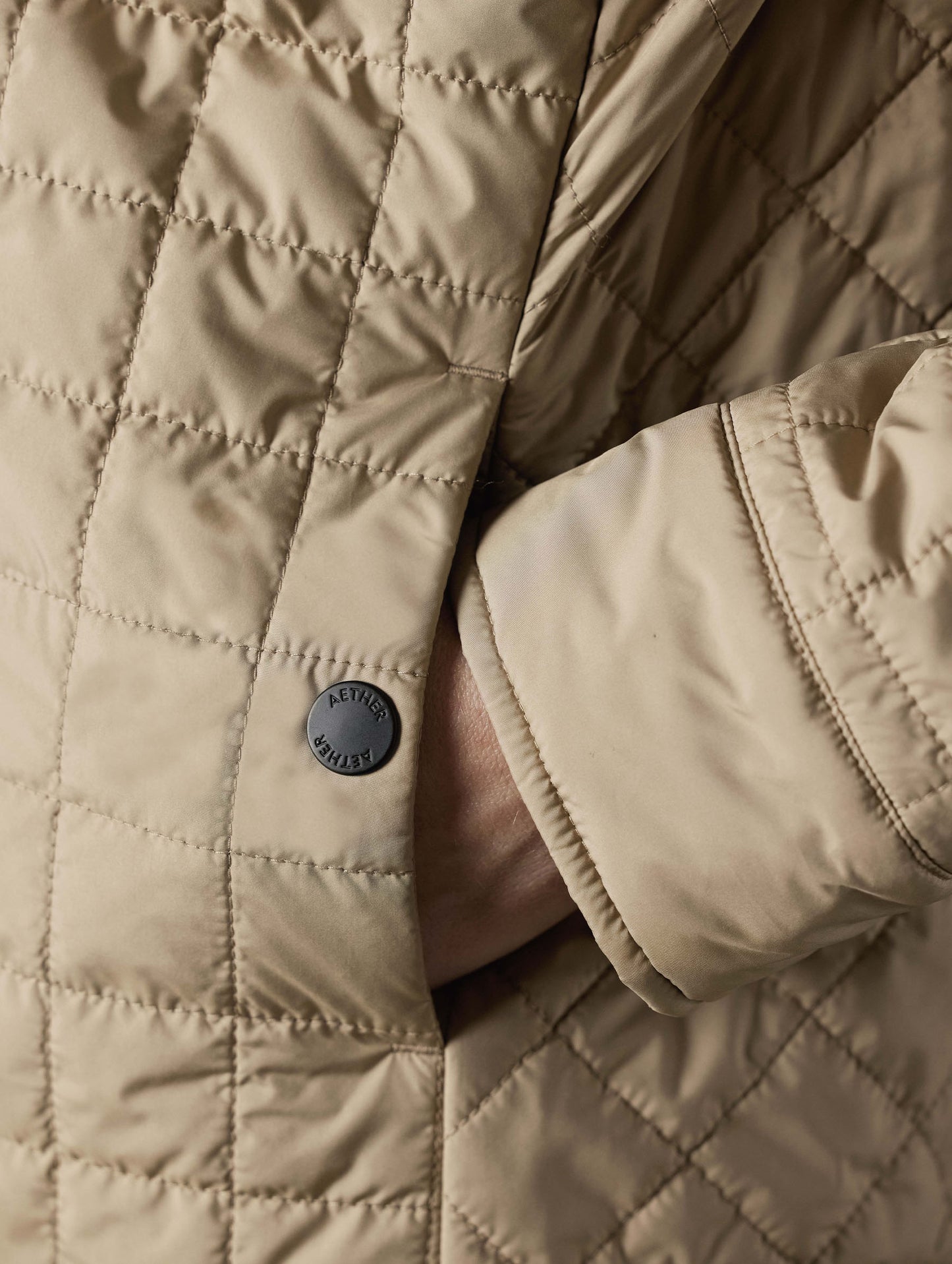 Closeup detailed view of the snap-secured left hand pocket on the Bardo Shirt Jacket in Chinchilla Brown from AETHER Apparel.