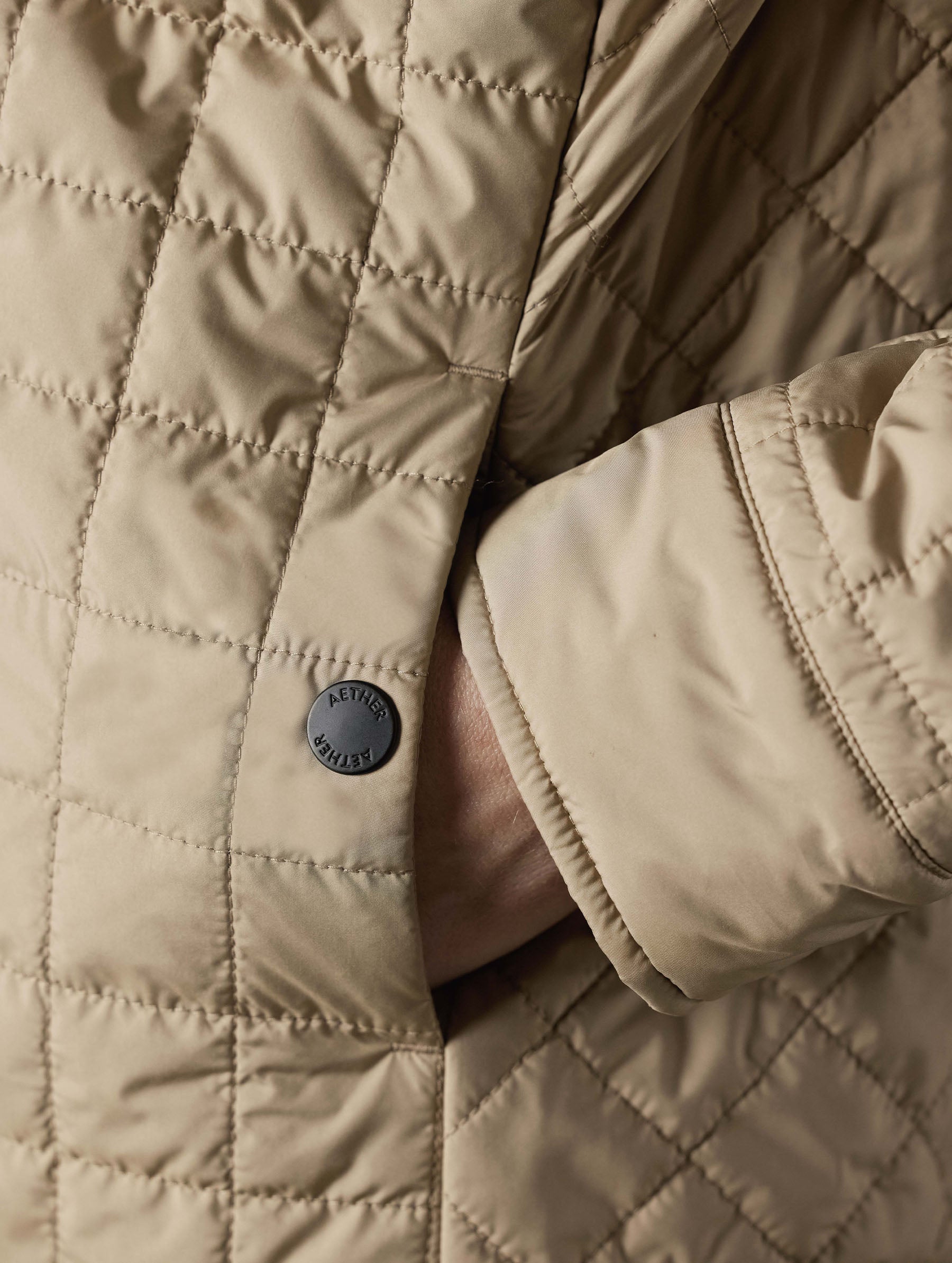 Closeup detailed view of the snap-secured left hand pocket on the Bardo Shirt Jacket in Chinchilla Brown from AETHER Apparel.