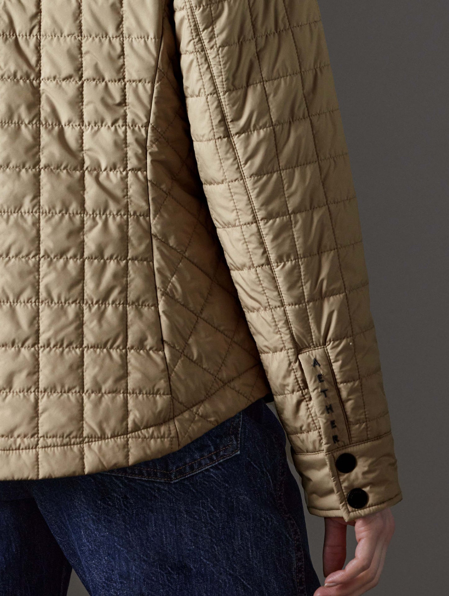 Closeup detailed view of the triple-snap gusset on the sleeves of the Bardo Shirt Jacket in Chinchilla Brown from AETHER Apparel.