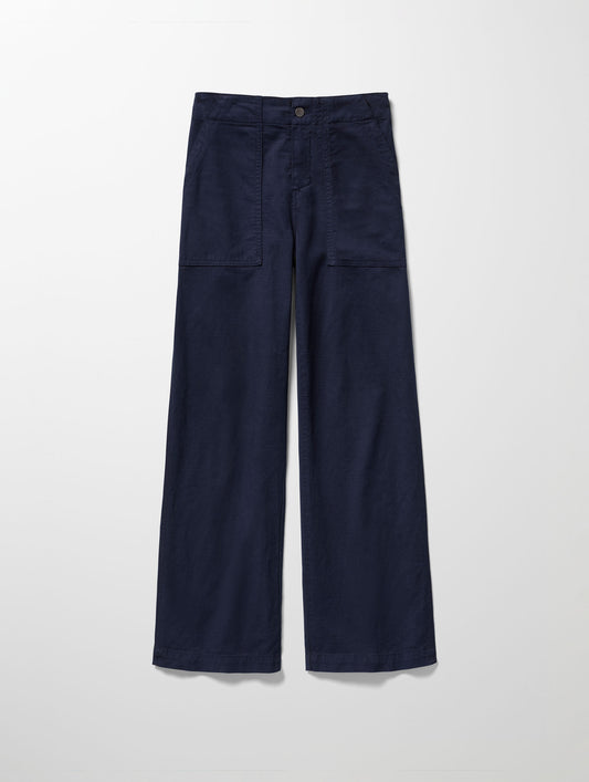 Flat lay image of Bella Travel Pant in Nordic Navy blue from AETHER Apparel.