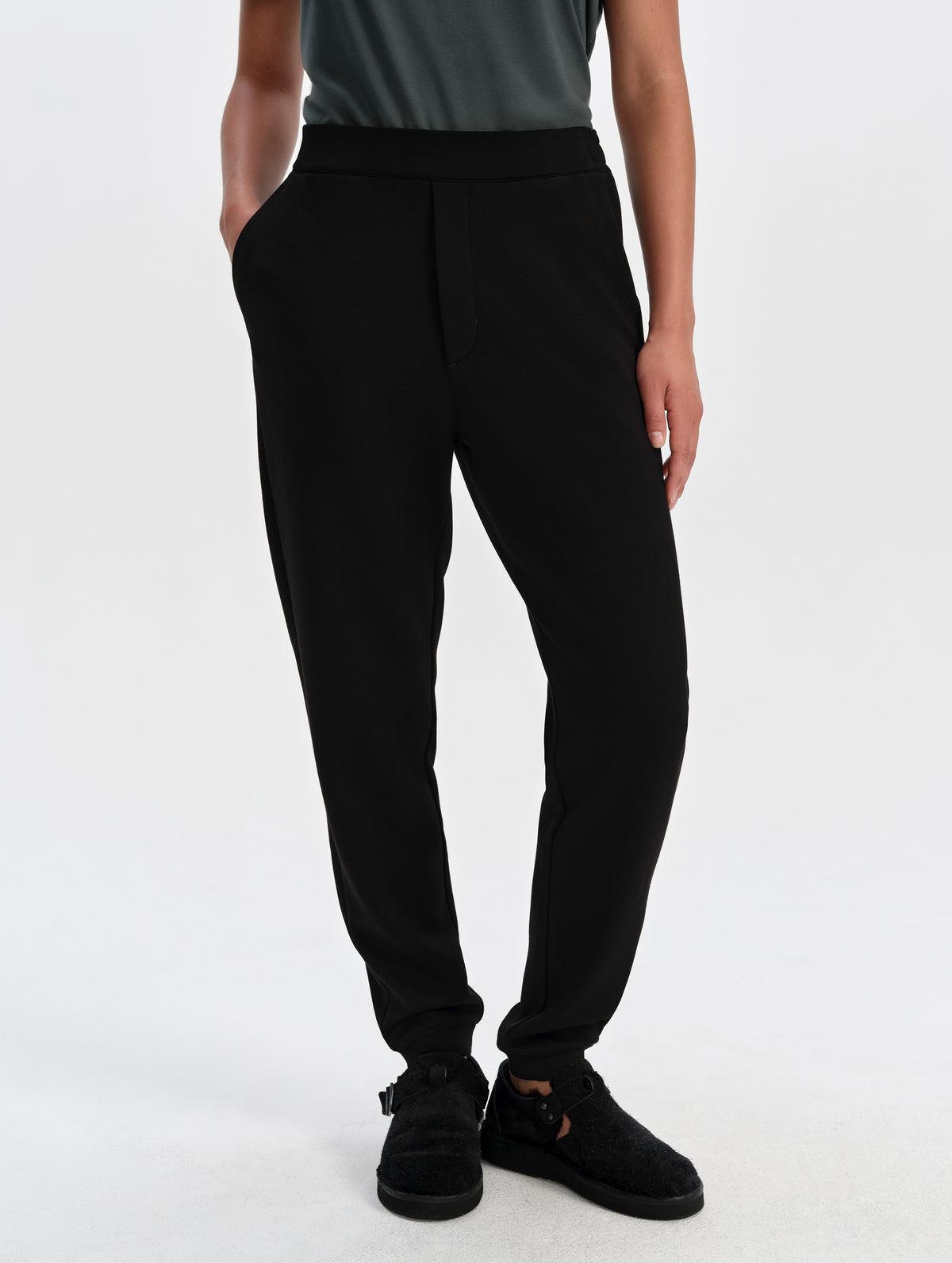 Front lower-body view of woman wearing the Blaire Premium Sweatpant in Onyx Black from AETHER Apparel.