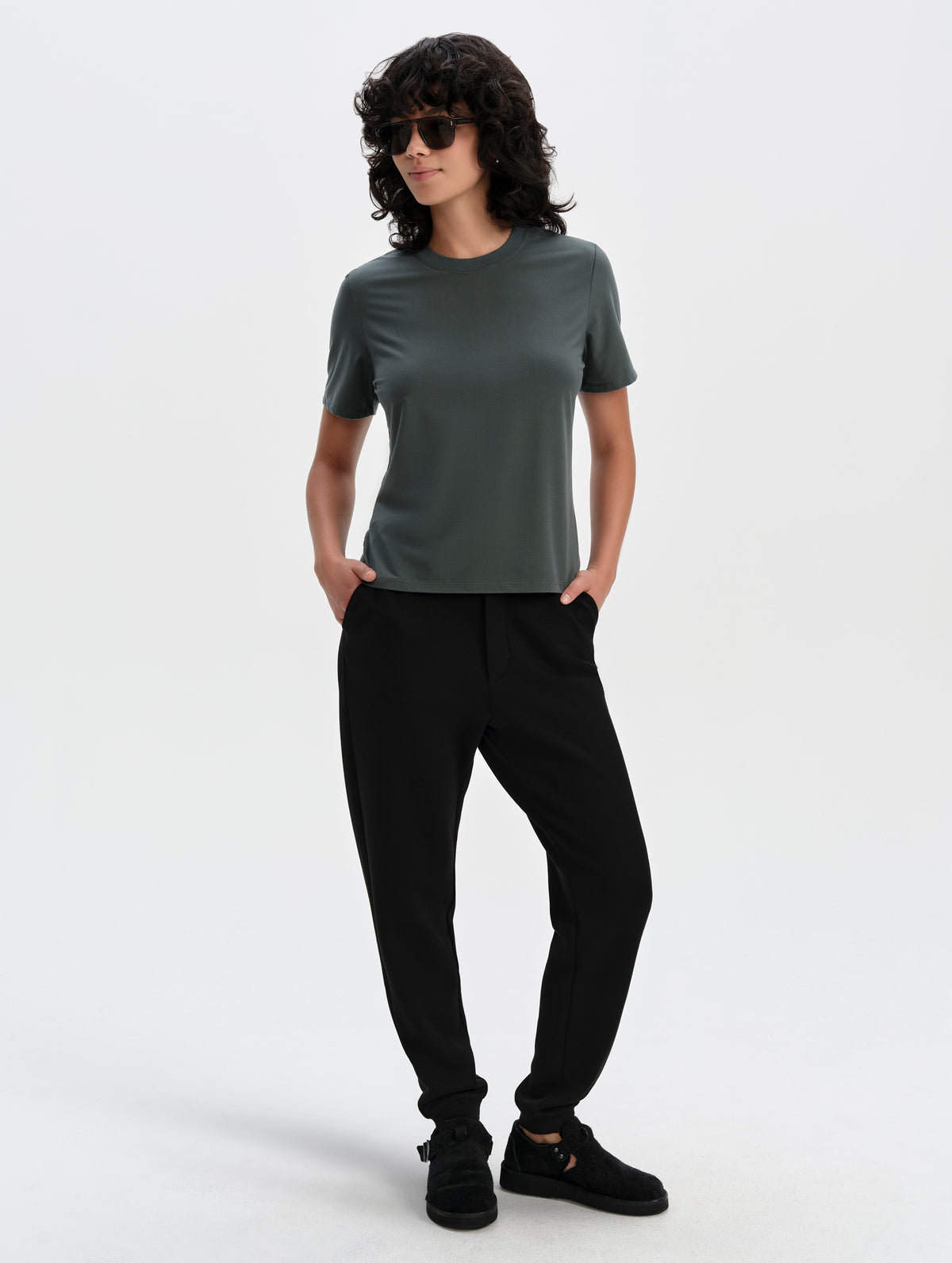 Front full-body view of woman wearing the Blaire Premium Sweatpant in Onyx Black from AETHER Apparel.