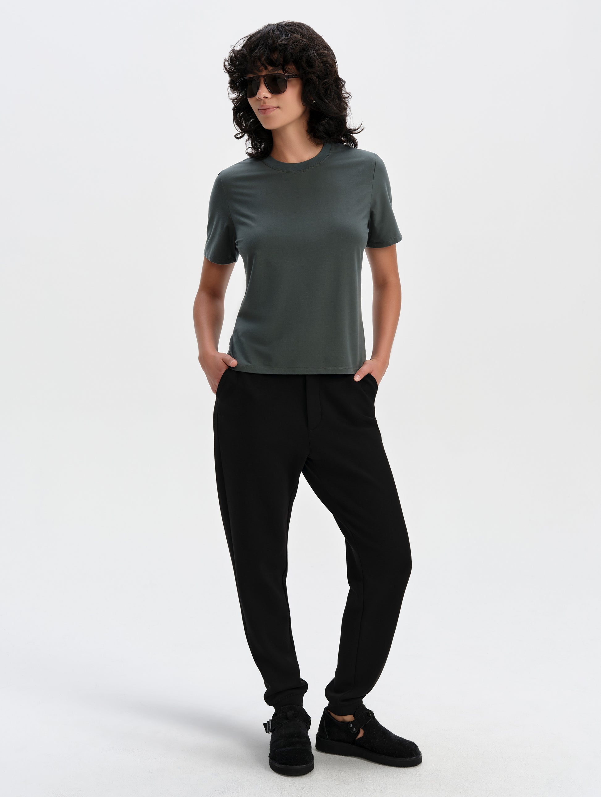 Front full-body view of woman wearing the Blaire Premium Sweatpant in Onyx Black from AETHER Apparel.