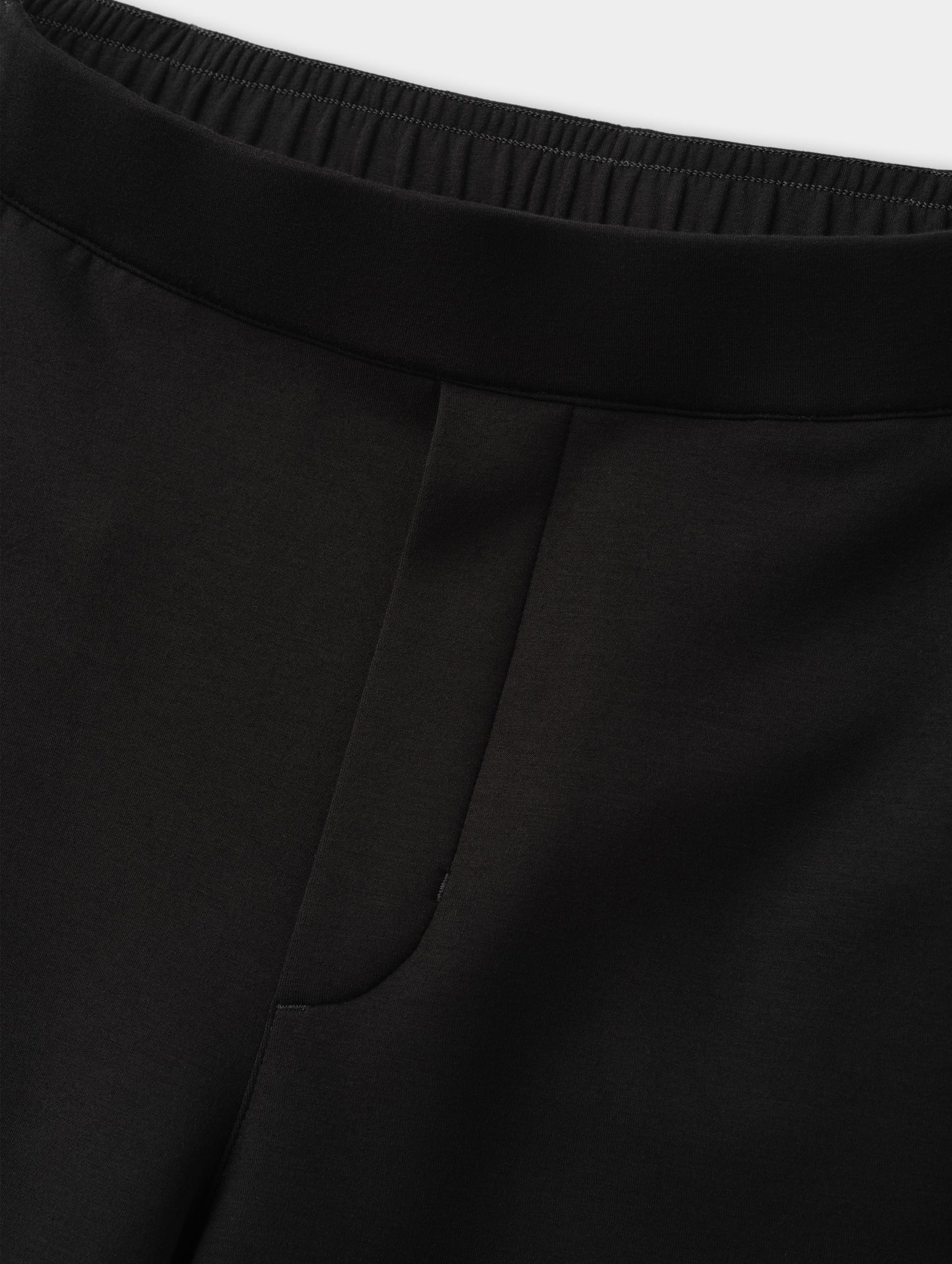 Closeup detailed view of the elasticated waistband and faux fly stitch on the Blaire Premium Sweatpant in Onyx Black from AETHER Apparel.