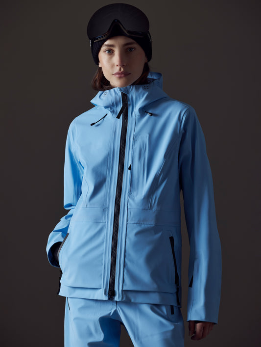 Front view of woman wearing Boyd Snow Jacket in Atlas Blue from AETHER Apparel.