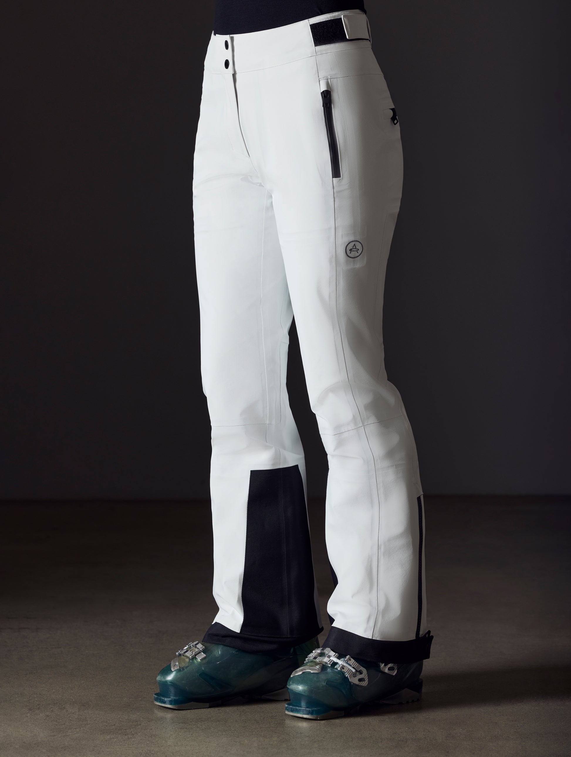 woman wearing white snow pant from AETHER Apparel