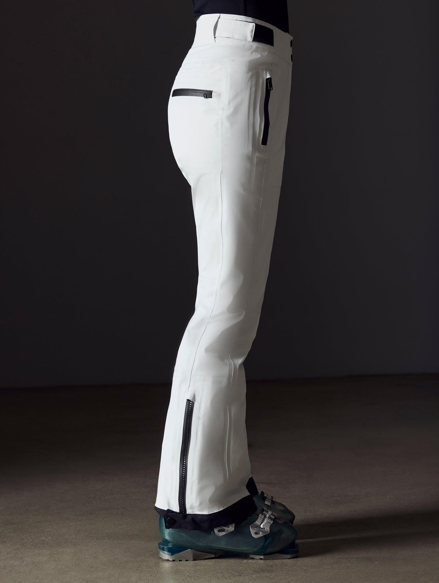 woman wearing white snow pant from AETHER Apparel