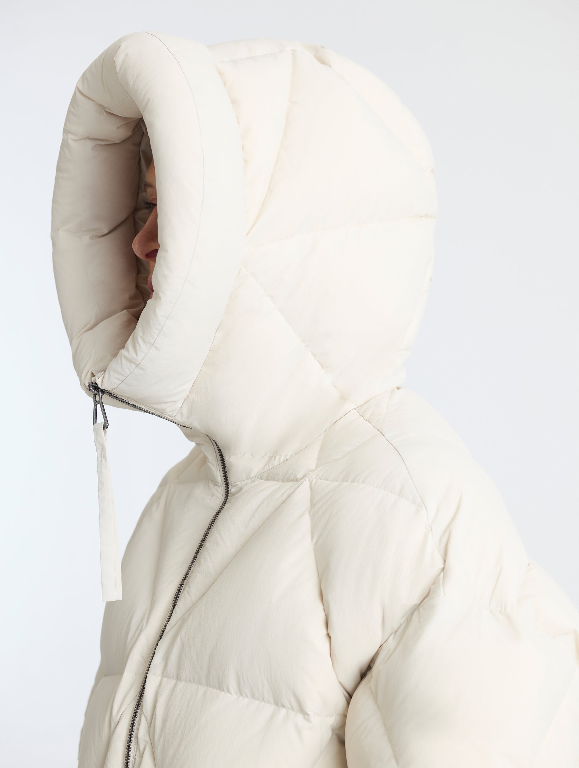Closeup detailed view of the oversized insulated 3-piece insulated hood on the Callie Oversized Down Parka in Bone from AETHER Apparel.