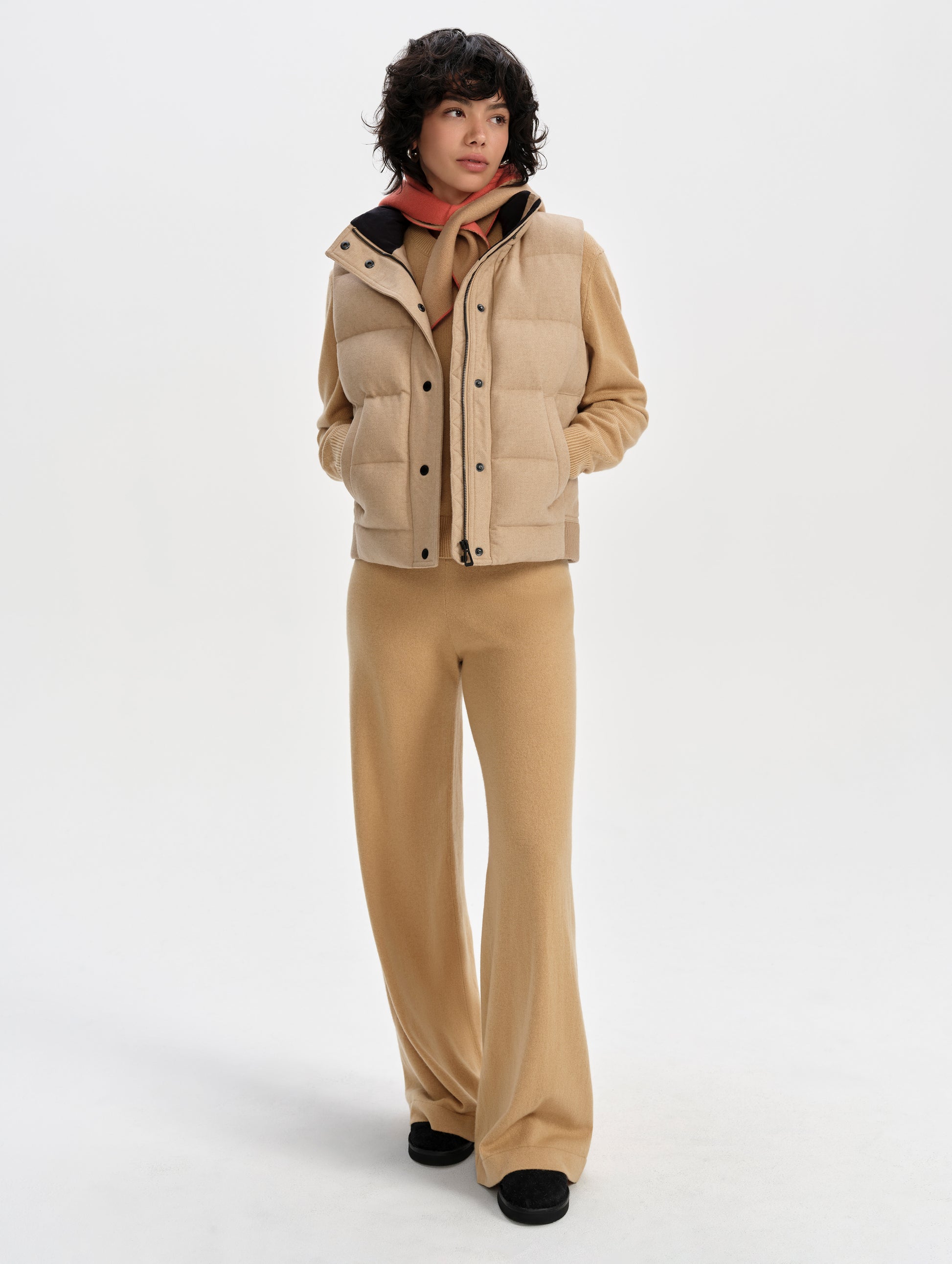 Front full-body view of woman wearing Channing Vest 2.0 in Latte Brown from AETHER Apparel.