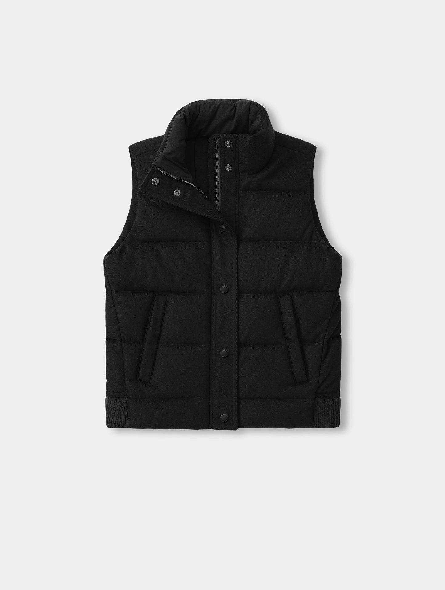 Flat lay view of the Channing Vest 2.0 in Onyx Black from AETHER Apparel.