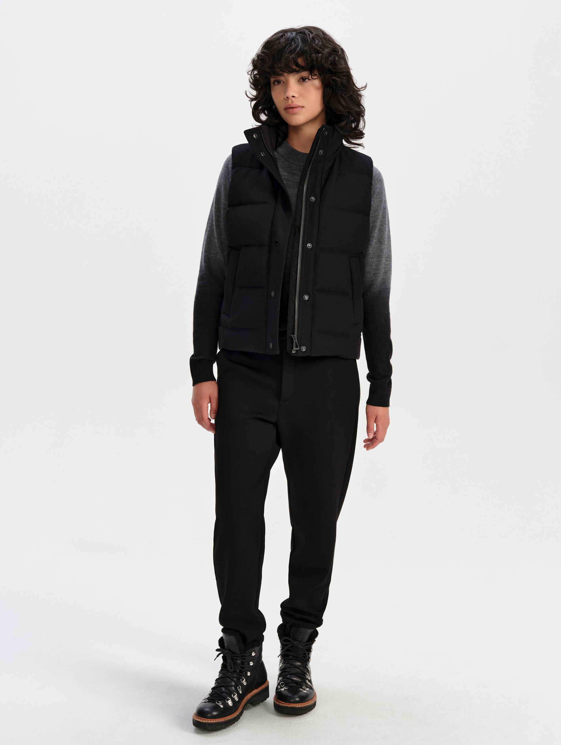 Front full-body view of woman wearing Channing Vest 2.0 in Onyx Black from AETHER Apparel.