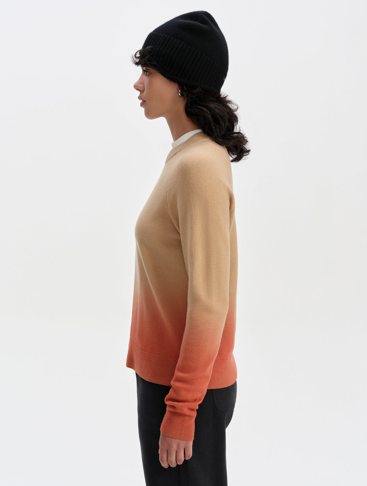 Side profile upper-body view of woman wearing the Dash Ombre Sweater in Latte Brown from AETHER Apparel.