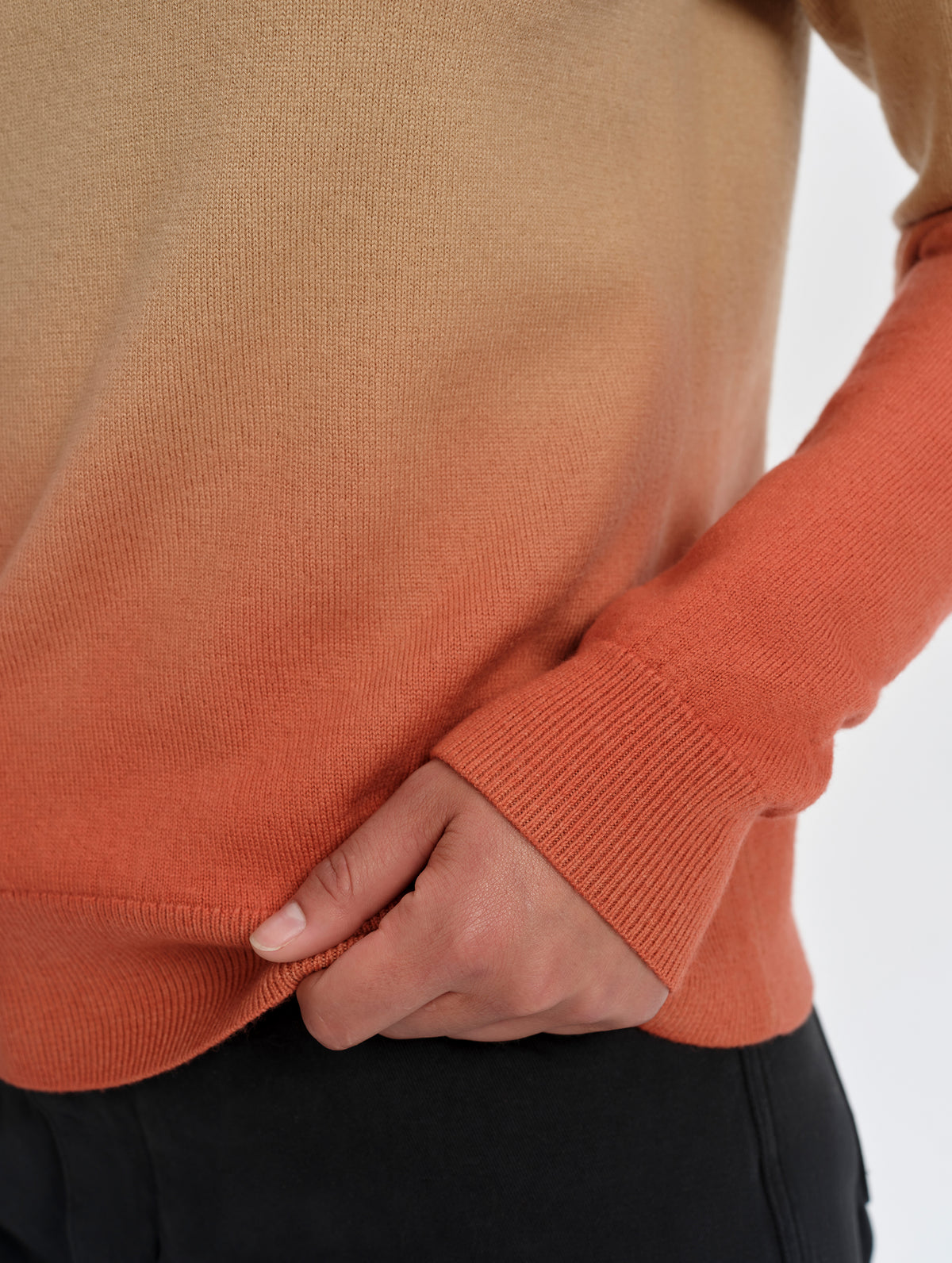Closeup detailed view of the hem and sleeve cuffs on the Dash Ombre Sweater in Latte Brown from AETHER Apparel.