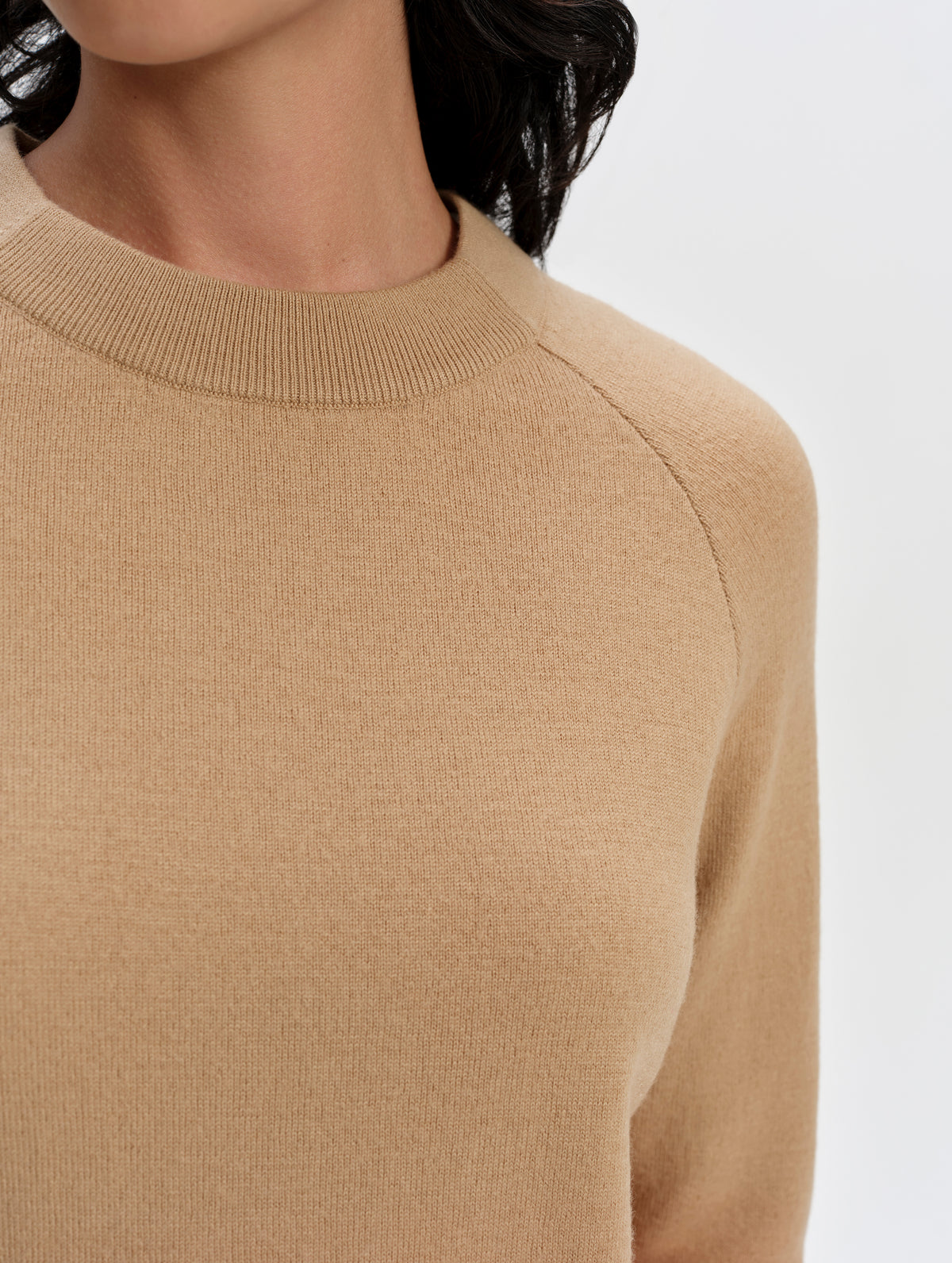 Closeup detailed view of the rib knit front collar and shoulder seam on the Dash Ombre Sweater in Latte Brown from AETHER Apparel.
