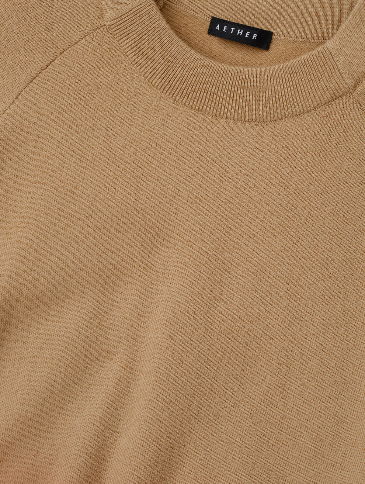 Closeup detailed view of the pieced in collar with rib knit front on the Dash Ombre Sweater in Latte Brown from AETHER Apparel.