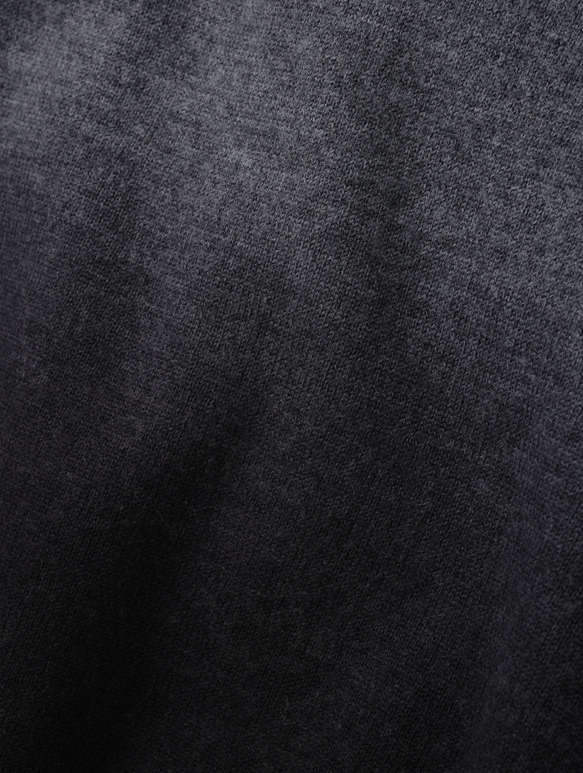 Closeup detailed view of the two-tone dip-dyed colorway on the Dash Ombre Sweater in Charcoal Grey from AETHER Apparel.