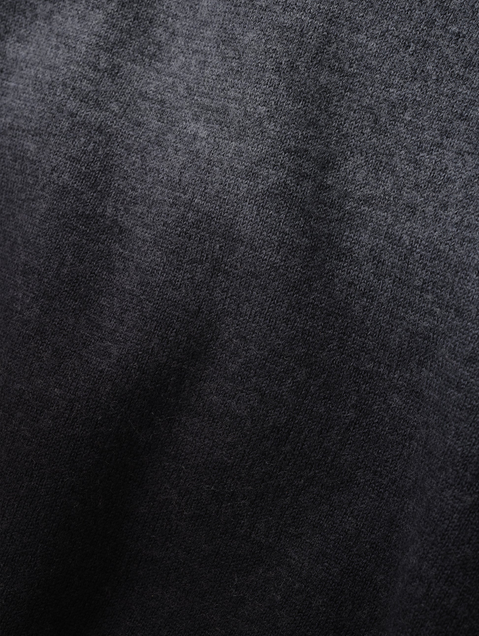 Closeup detailed view of the two-tone dip-dyed colorway on the Dash Ombre Sweater in Charcoal Grey from AETHER Apparel.