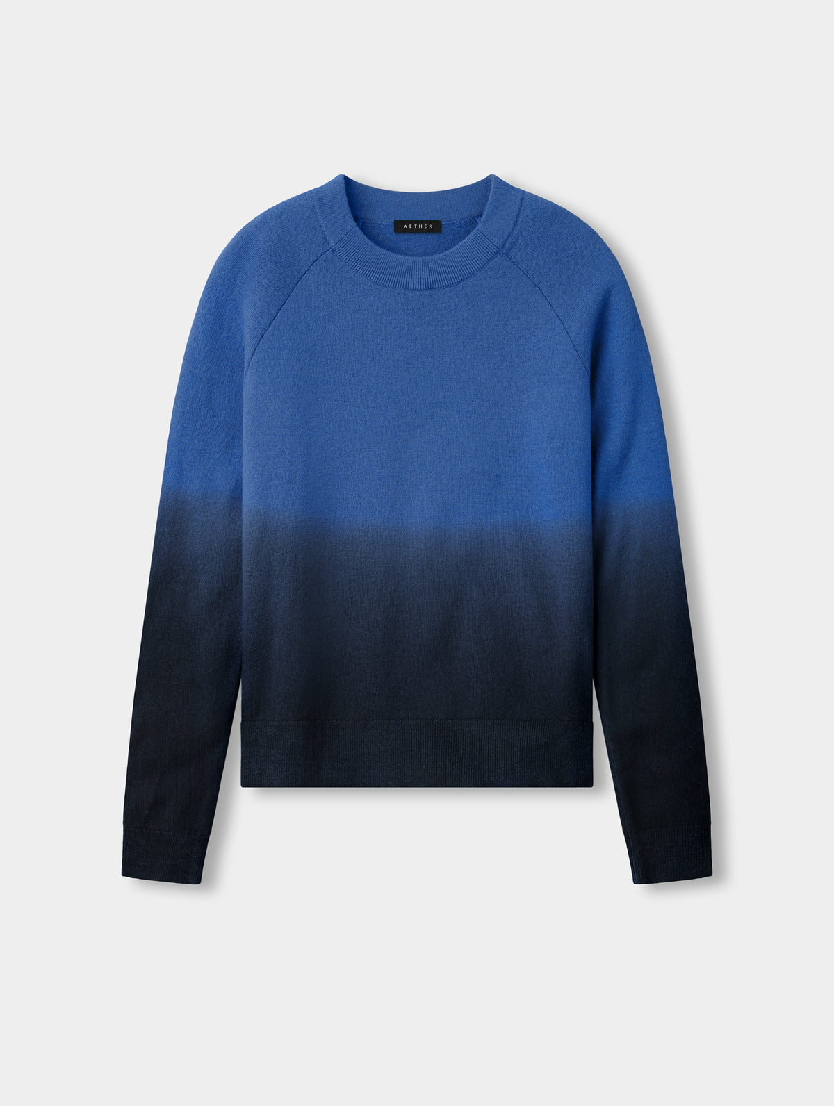 Flat lay view of the Dash Ombre Sweater in Galaxy Blue from AETHER Apparel.
