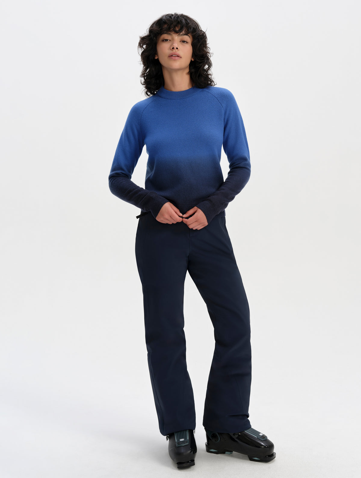 Front full-body view of woman wearing the Dash Ombre Sweater in Galaxy Blue from AETHER Apparel.
