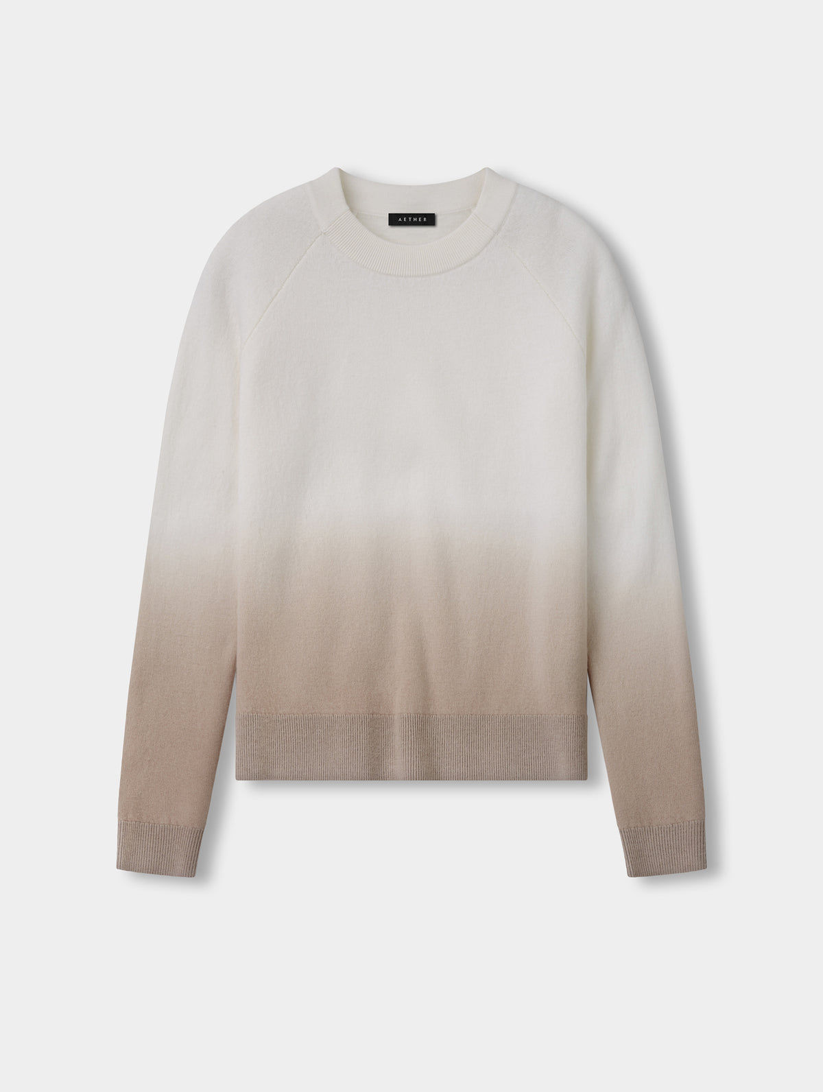 Flat lay view of the Dash Ombre Sweater in Winter White from AETHER Apparel.