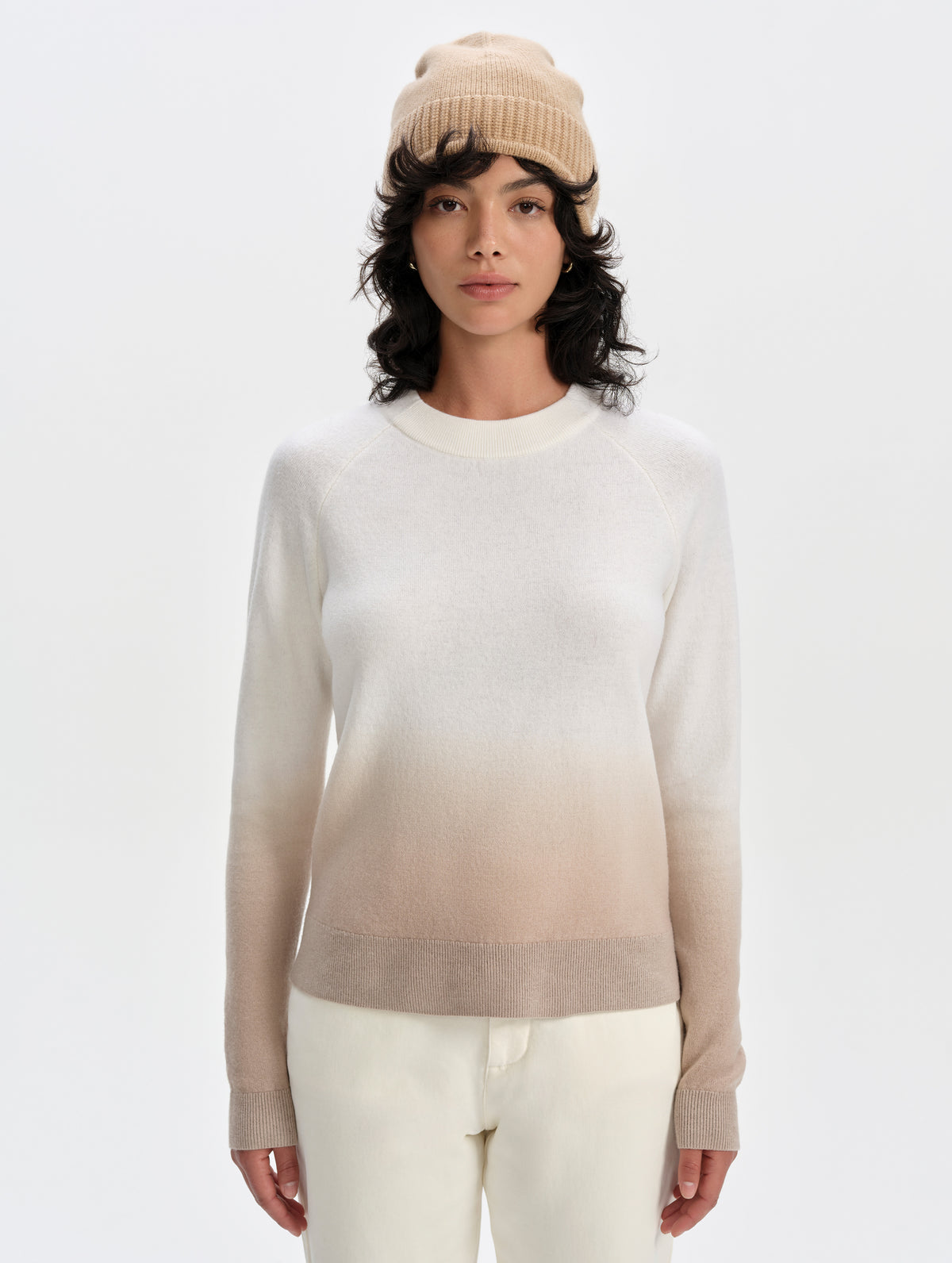 Front upper-body view of woman wearing the Dash Ombre Sweater in Winter White from AETHER Apparel.