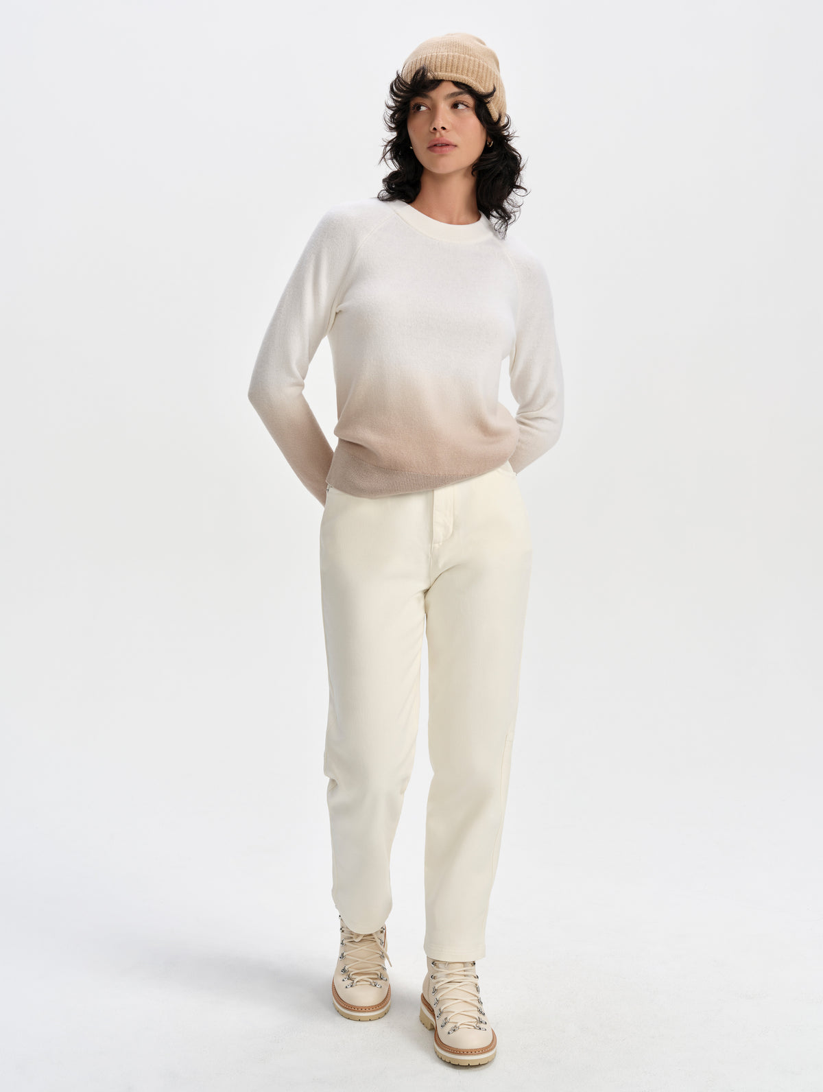 Front full-body view of woman wearing the Dash Ombre Sweater in Winter White from AETHER Apparel.