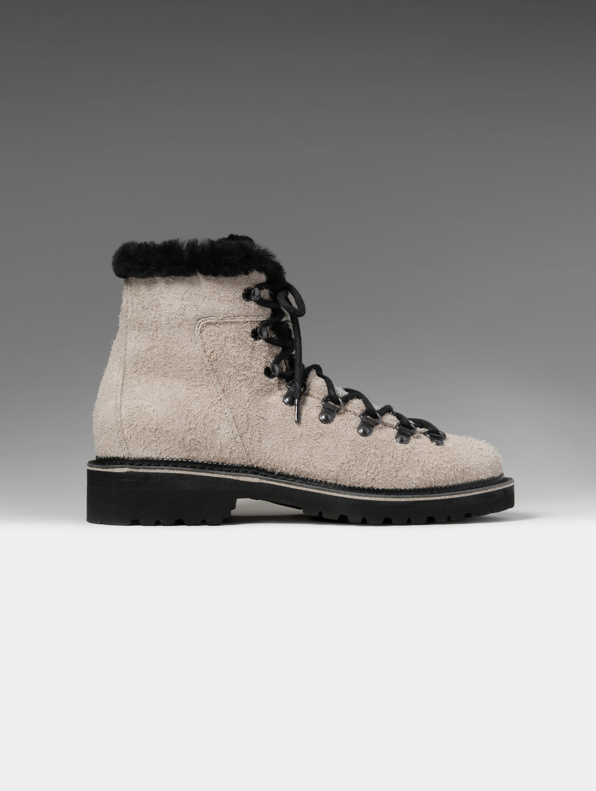 Side profile studio shot of the W Dolomite Boot w/ Shearling in Sandstone with black laces from AETHER Apparel.