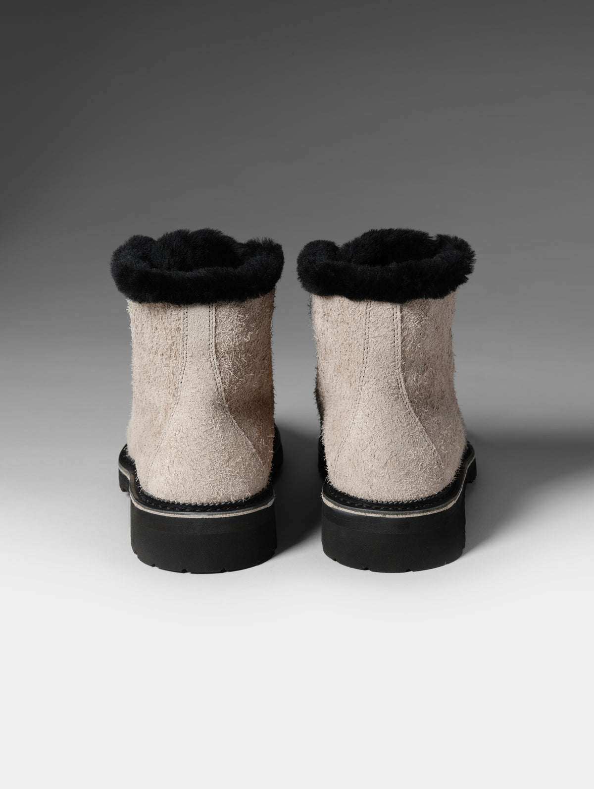 Rear studio shot of the W Dolomite Boot w/ Shearling in Sandstone from AETHER Apparel.