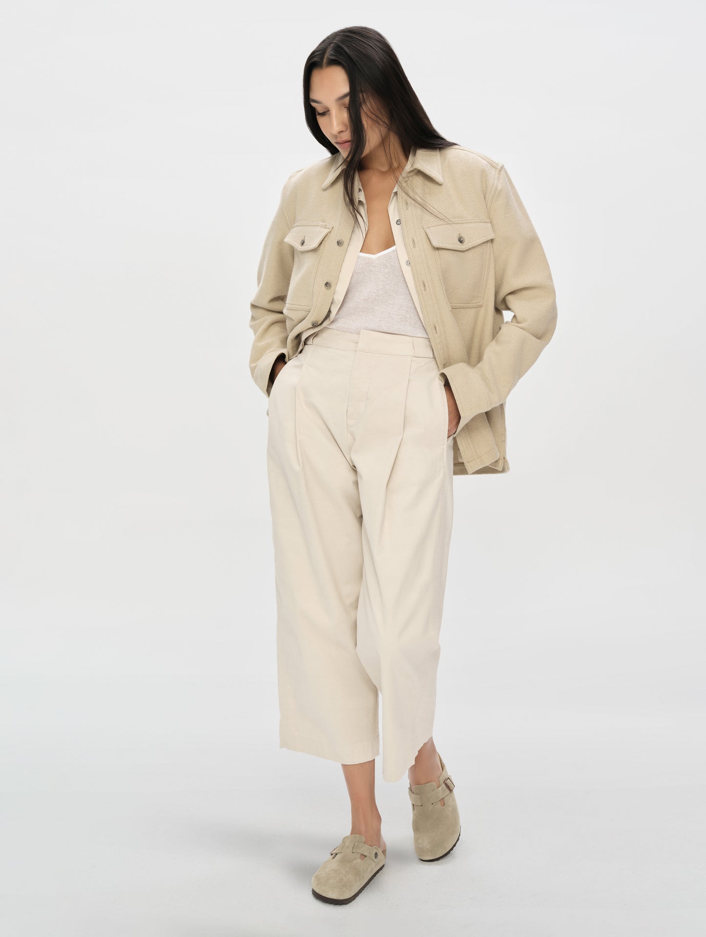 Front, full-body view of woman wearing the Dune Pant in Bone from AETHER Apparel.