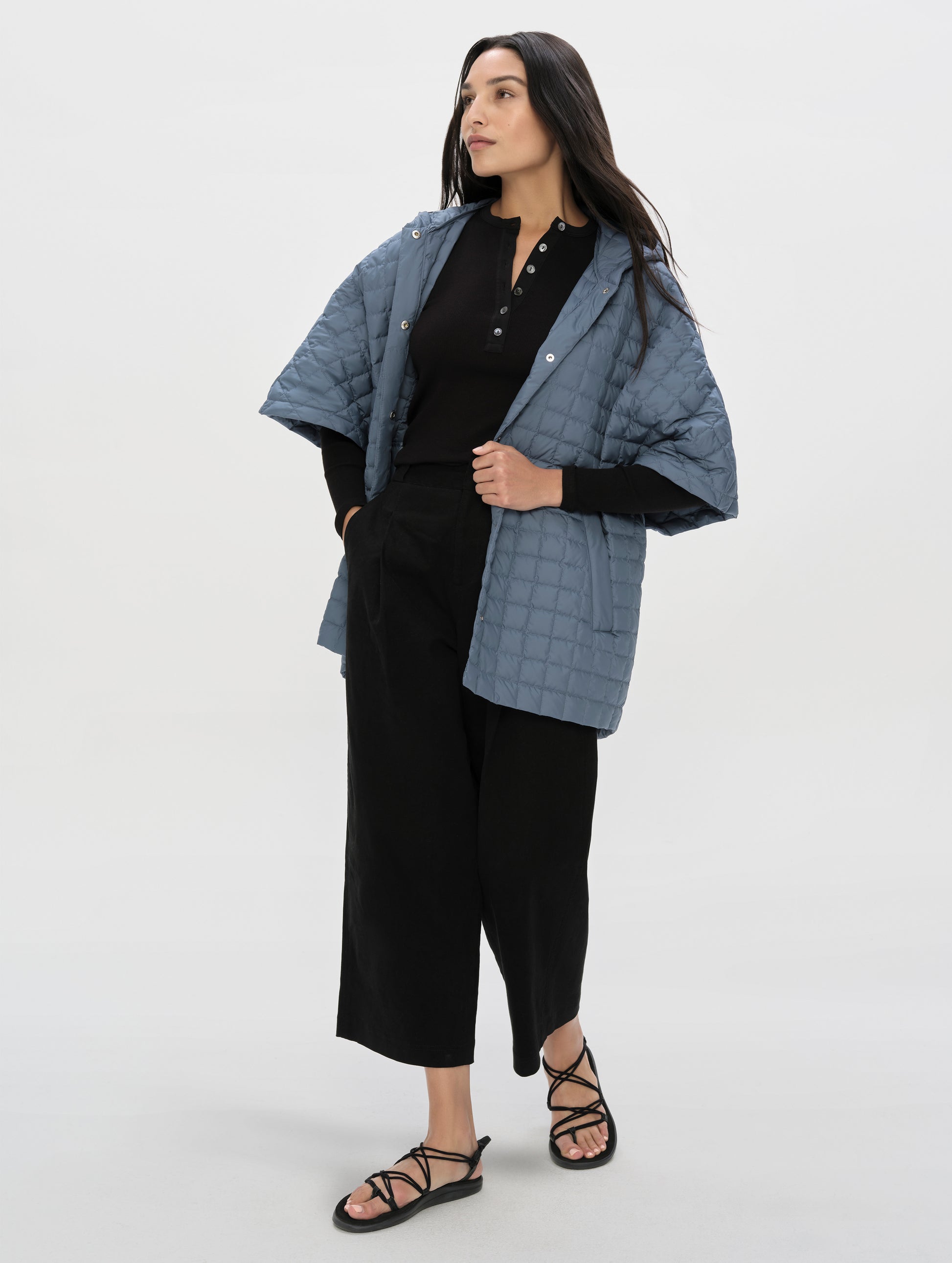 Front, 3/4, full-body view of woman wearing the Dune Pant in Onyx Black from AETHER Apparel.