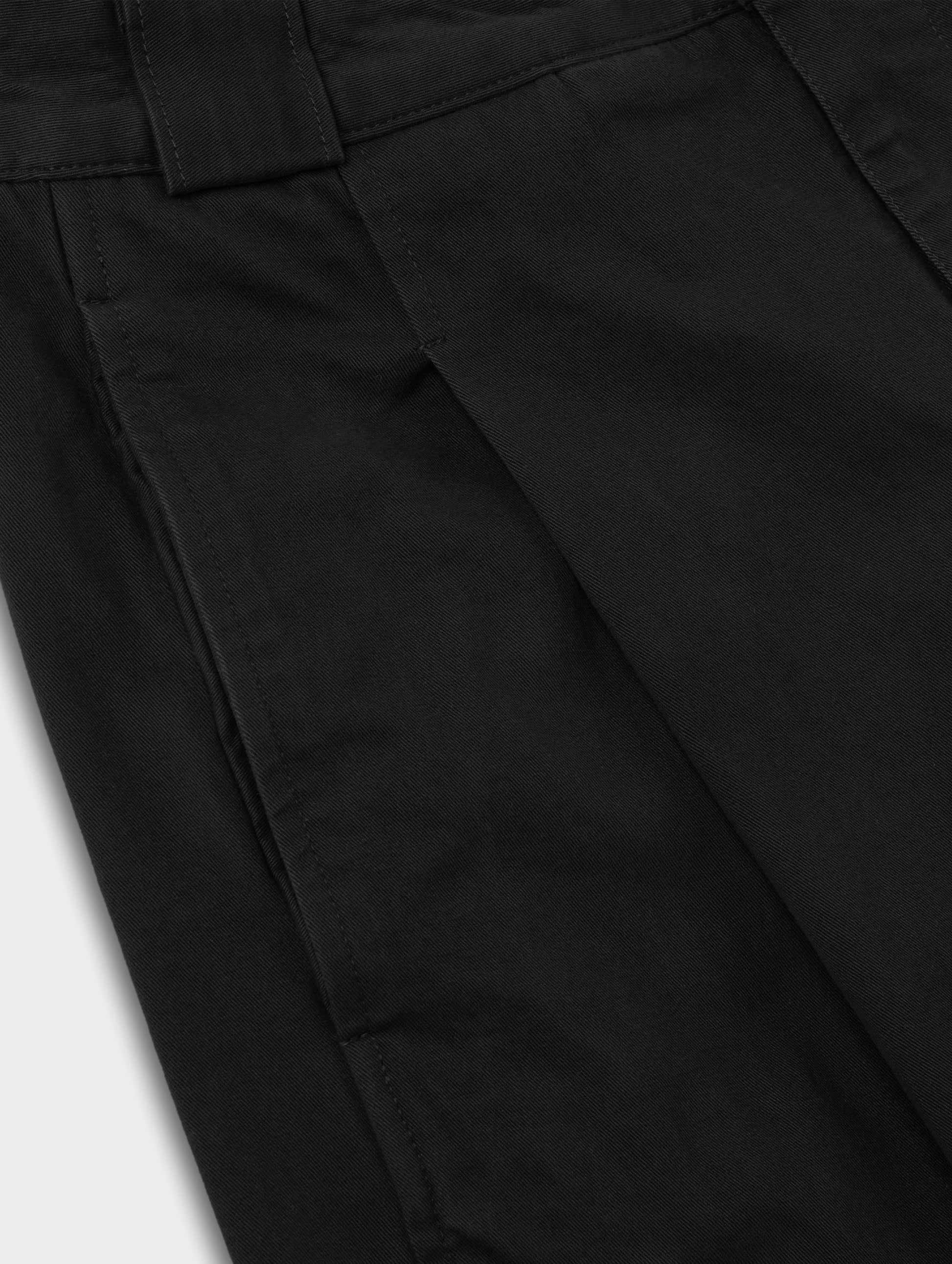 Closeup detailed view of the pleats on the Dune Pant in Onyx Black from AETHER Apparel.