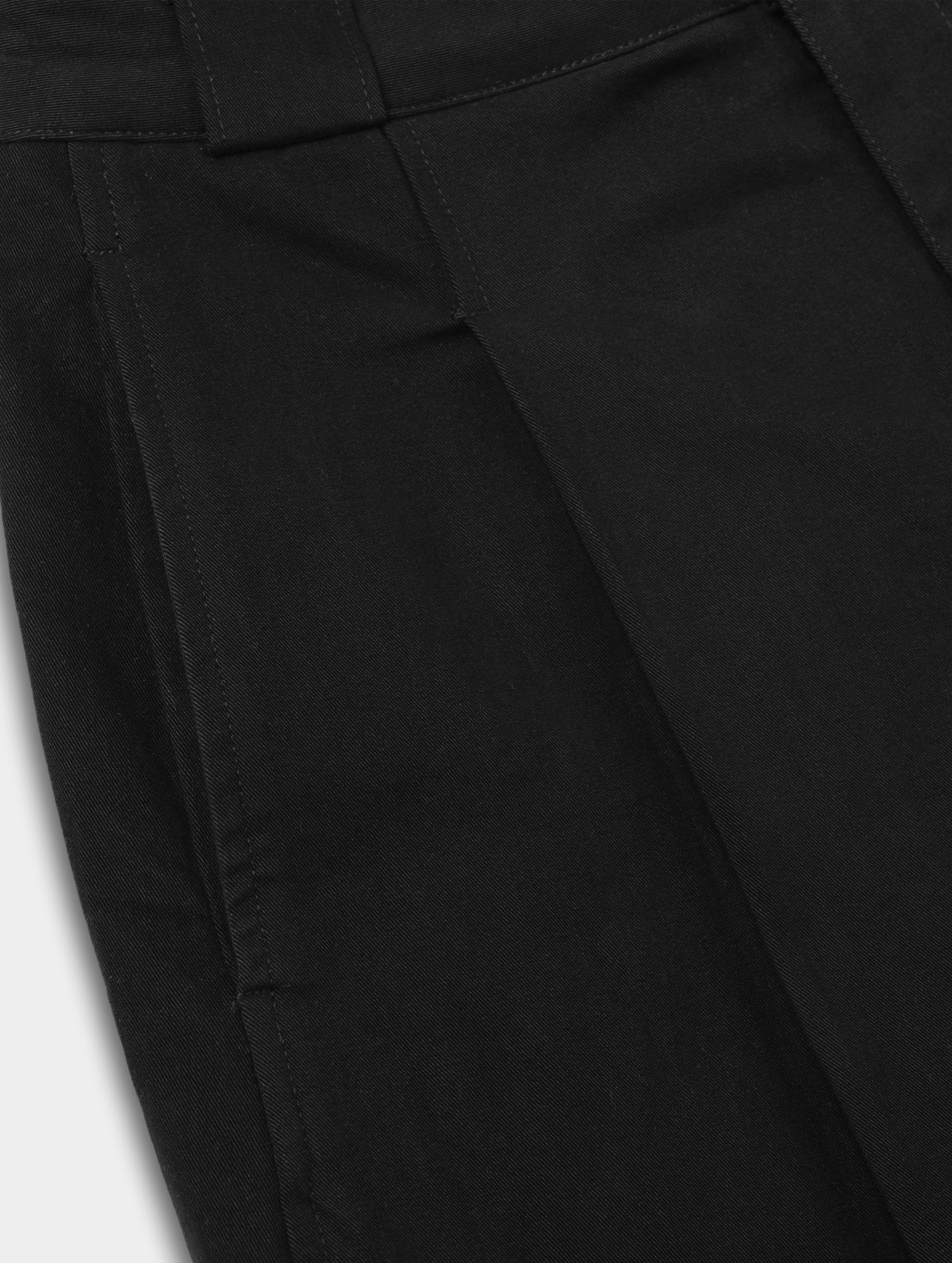 Closeup detailed view of the hand pockets and pleats on the Dune Short in Onyx Black from AETHER Apparel.