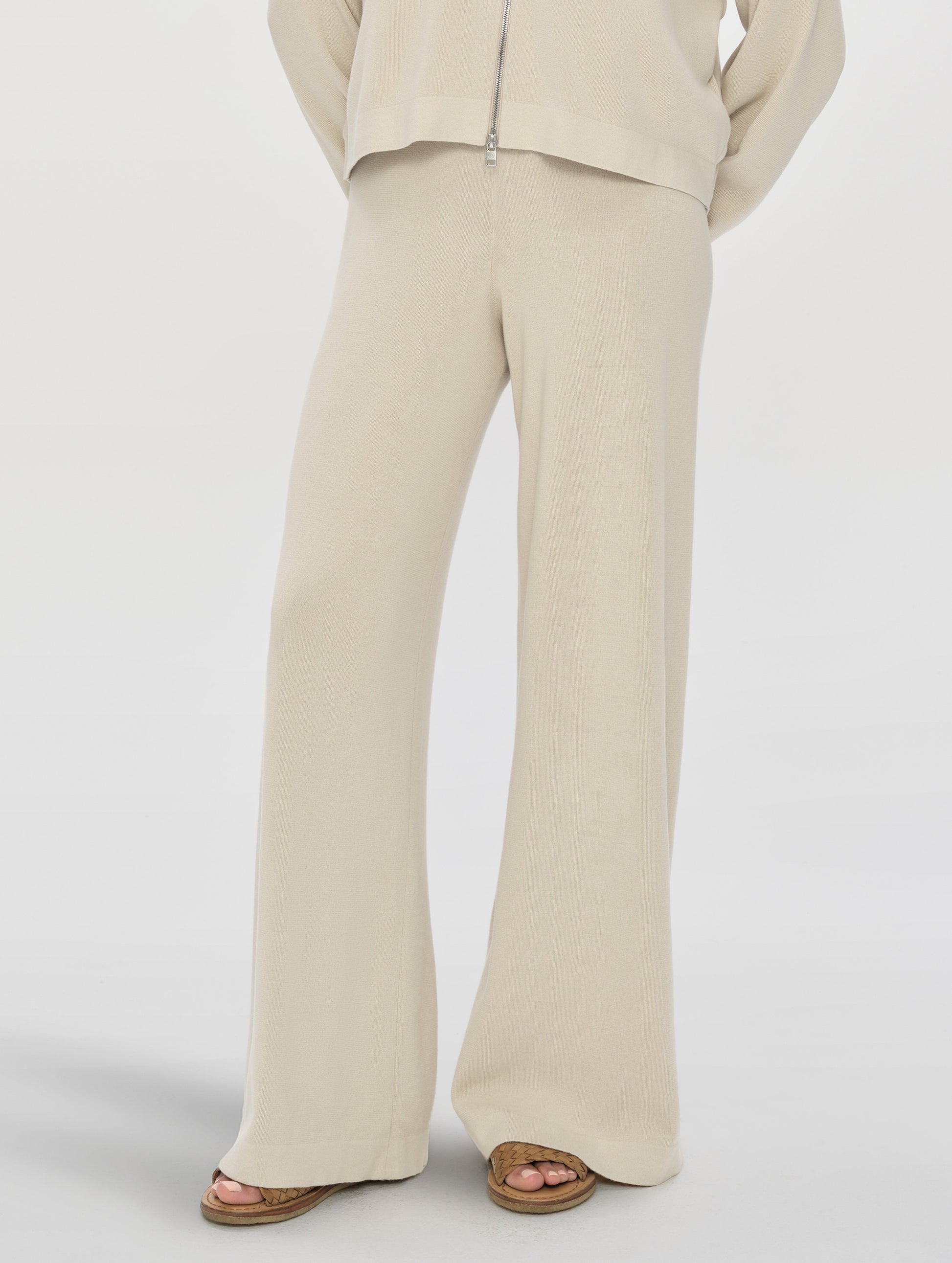 Front, lower-body view of woman wearing the Eliana Sweater Pant in Bone from AETHER Apparel.