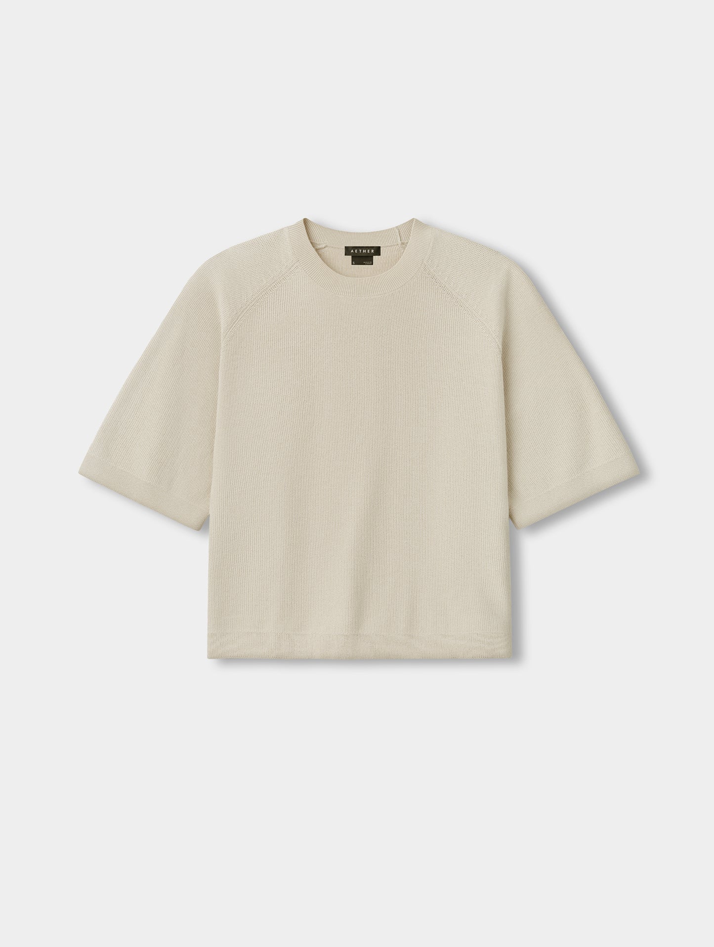 Flat lay view of the Eliana Sweater Tee in Bone from AETHER.