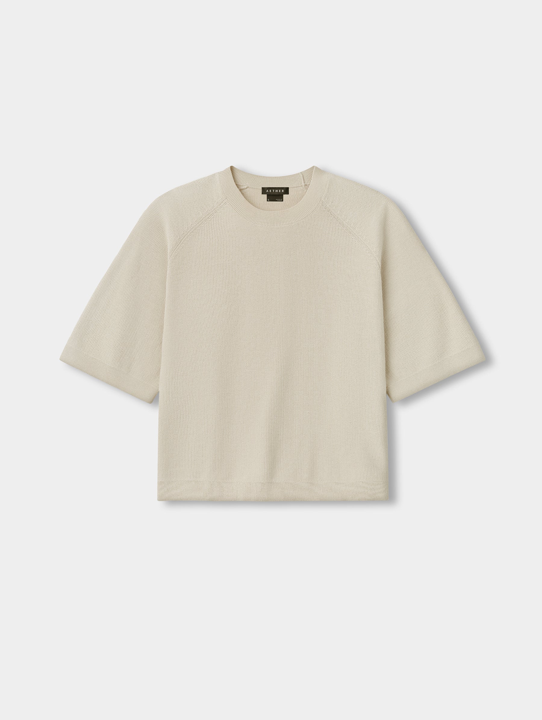 Flat lay view of the Eliana Sweater Tee in Bone from AETHER.
