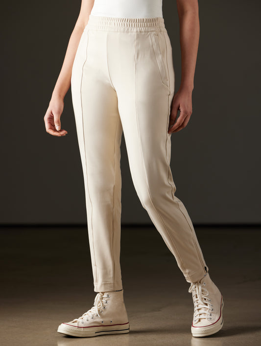 Woman wearing beige pants from AETHER Apparel