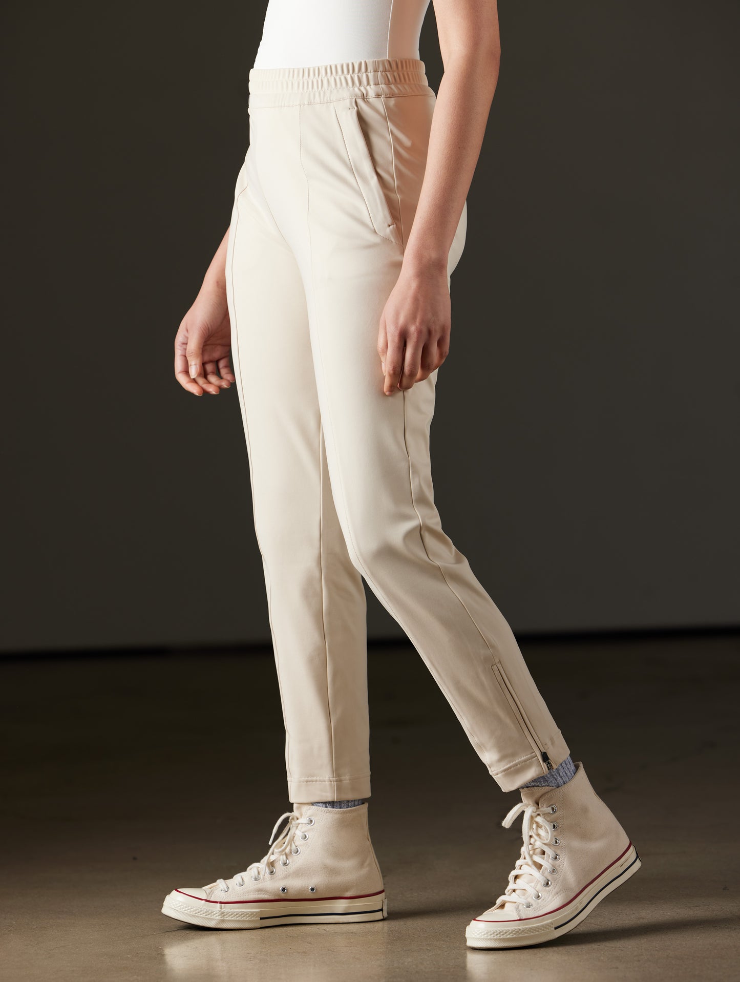 Woman wearing beige pants from AETHER Apparel