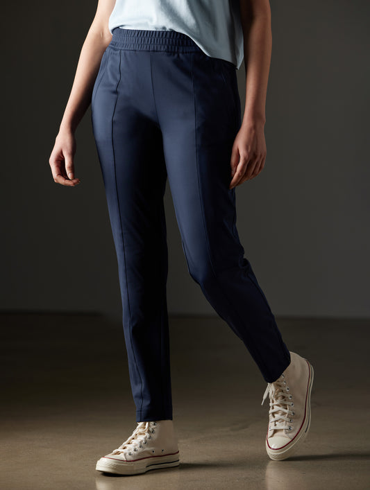 Woman wearing blue pants from AETHER Apparel