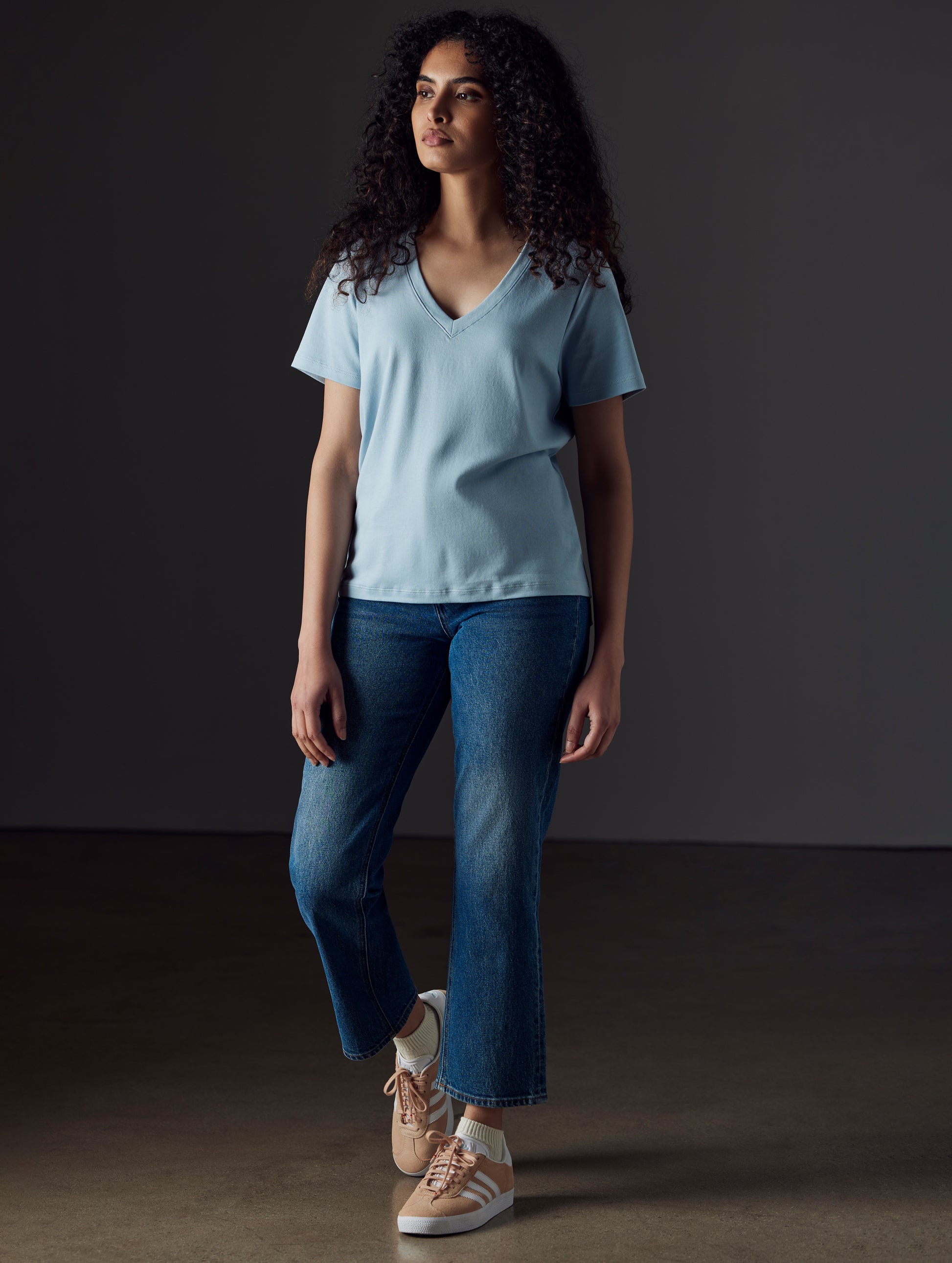 Woman wearing blue organic cotton v neck from AETHER Apparel