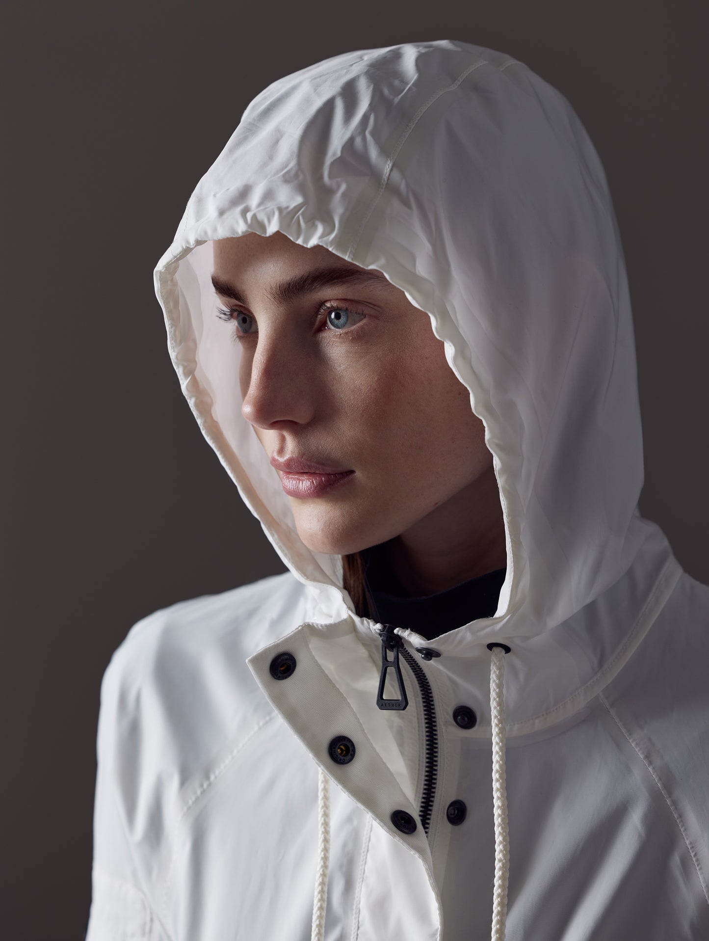 woman wearing white jacket from AETHER Apparel