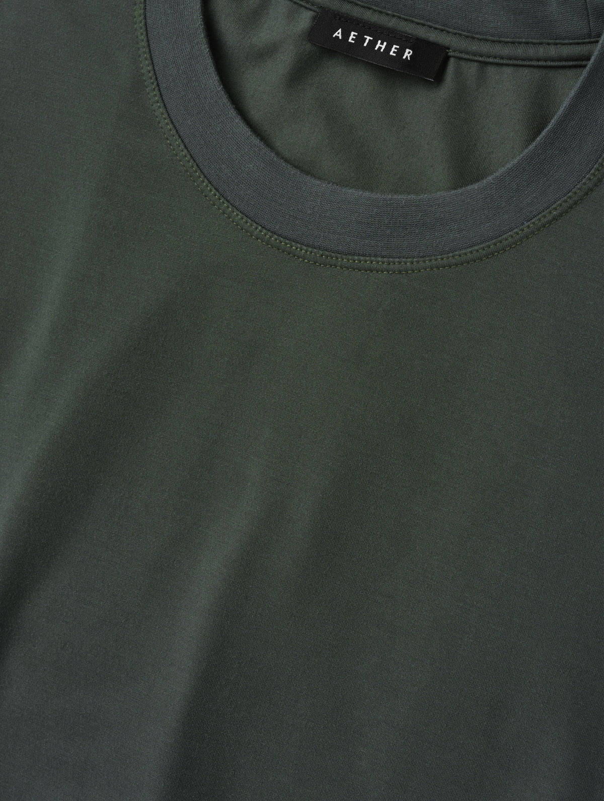 Closeup detailed view of the self neck band on the Hana Short-Sleeve Tee Shirt in Saville Green from AETHER Apparel.
