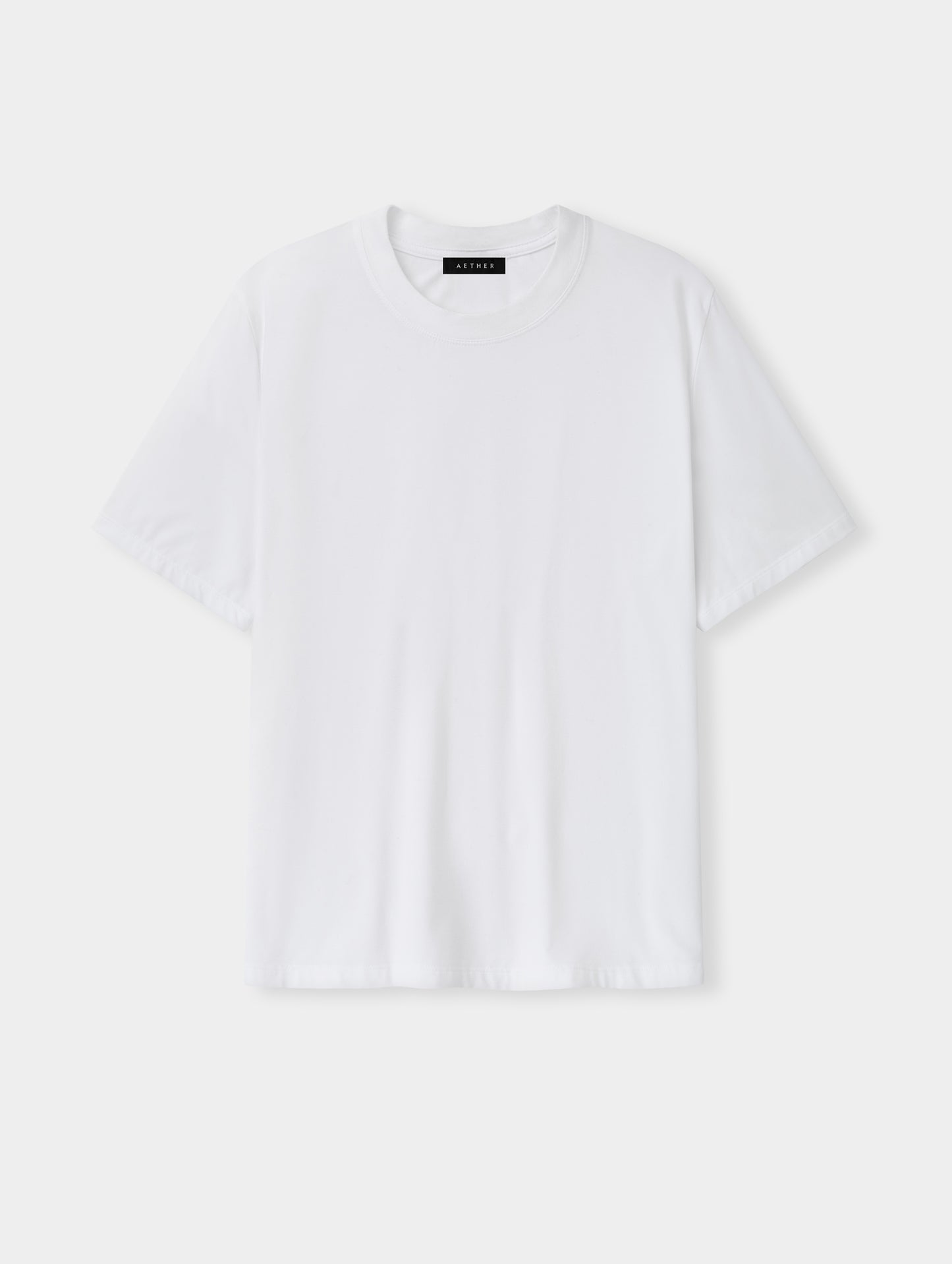 Flat lay view of the Hana Short-Sleeve Tee Shirt in White from AETHER Apparel.