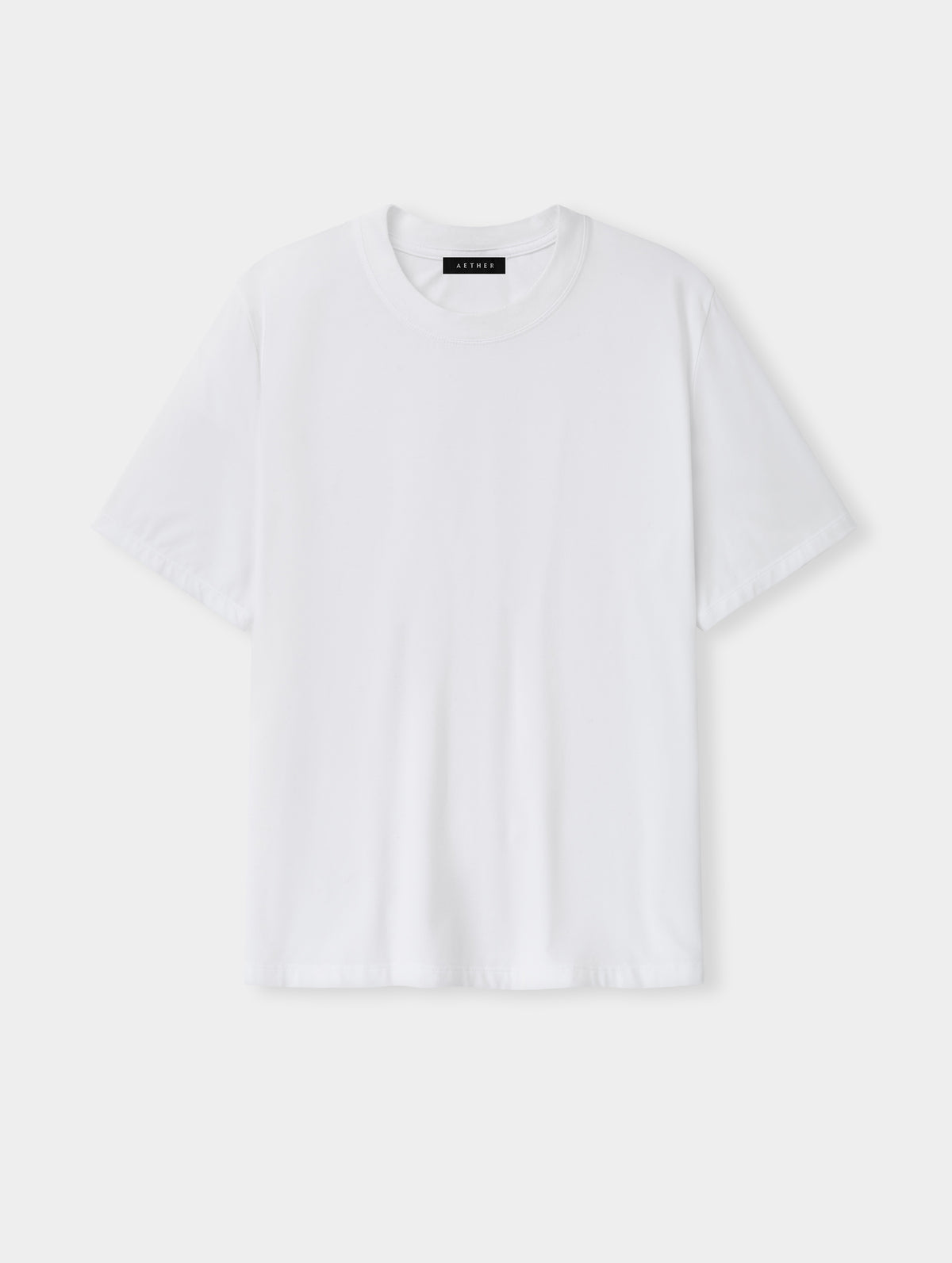Flat lay view of the Hana Short-Sleeve Tee Shirt in White from AETHER Apparel.