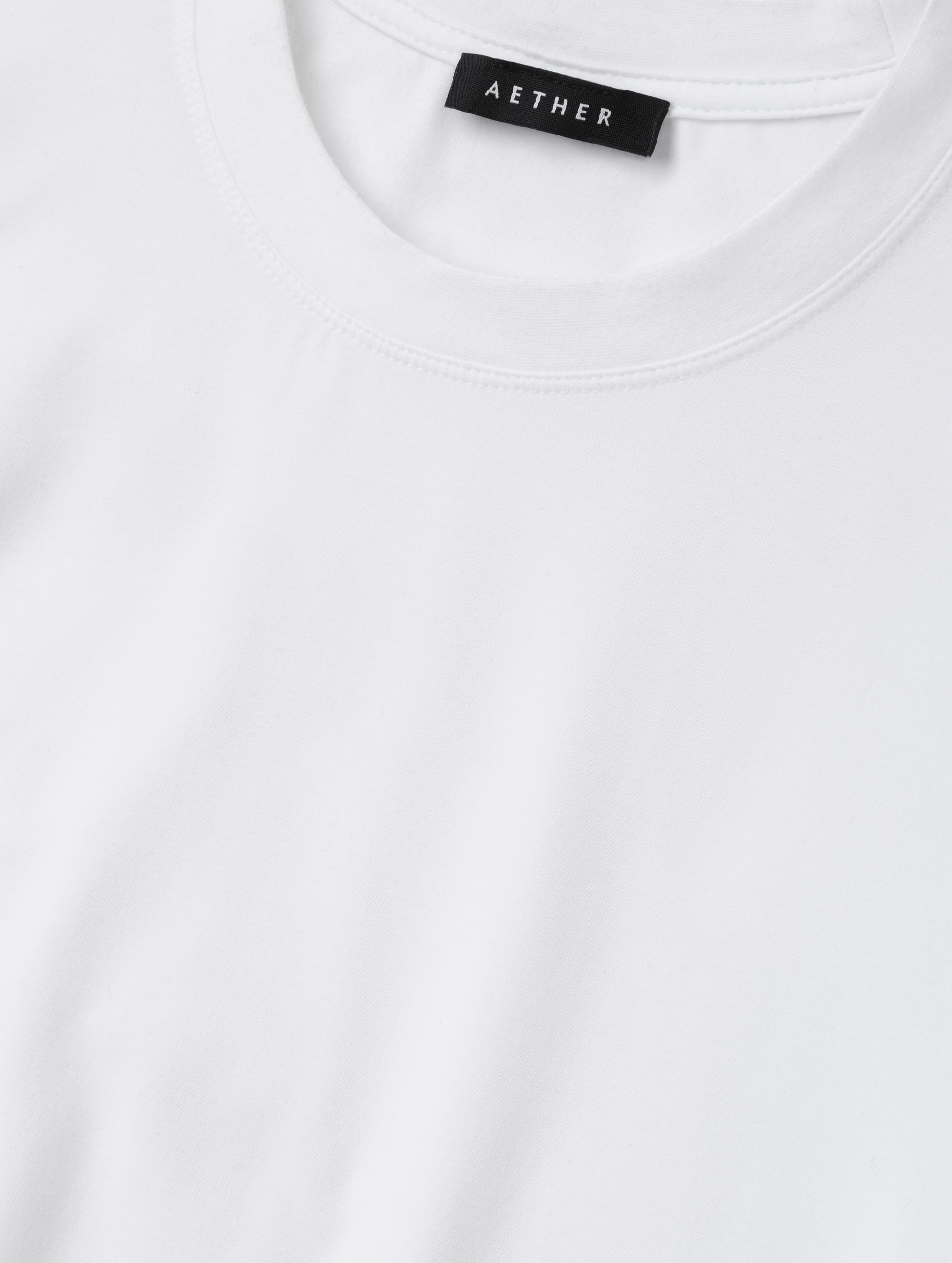 Closeup detailed view of the self neck band on the Hana Short-Sleeve Tee Shirt in White from AETHER Apparel.