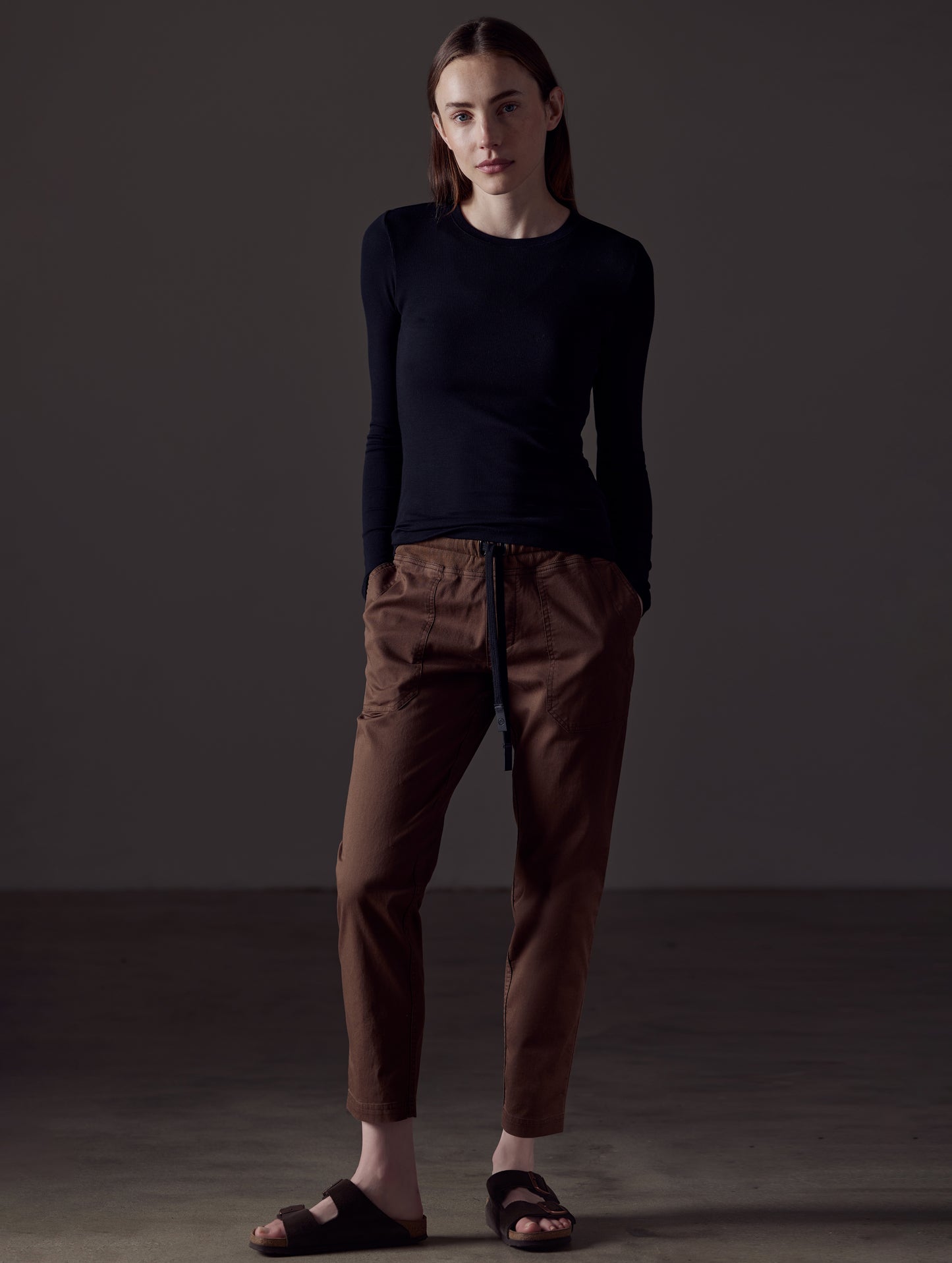 Woman wearing brown cotton pant from AETHER Apparel