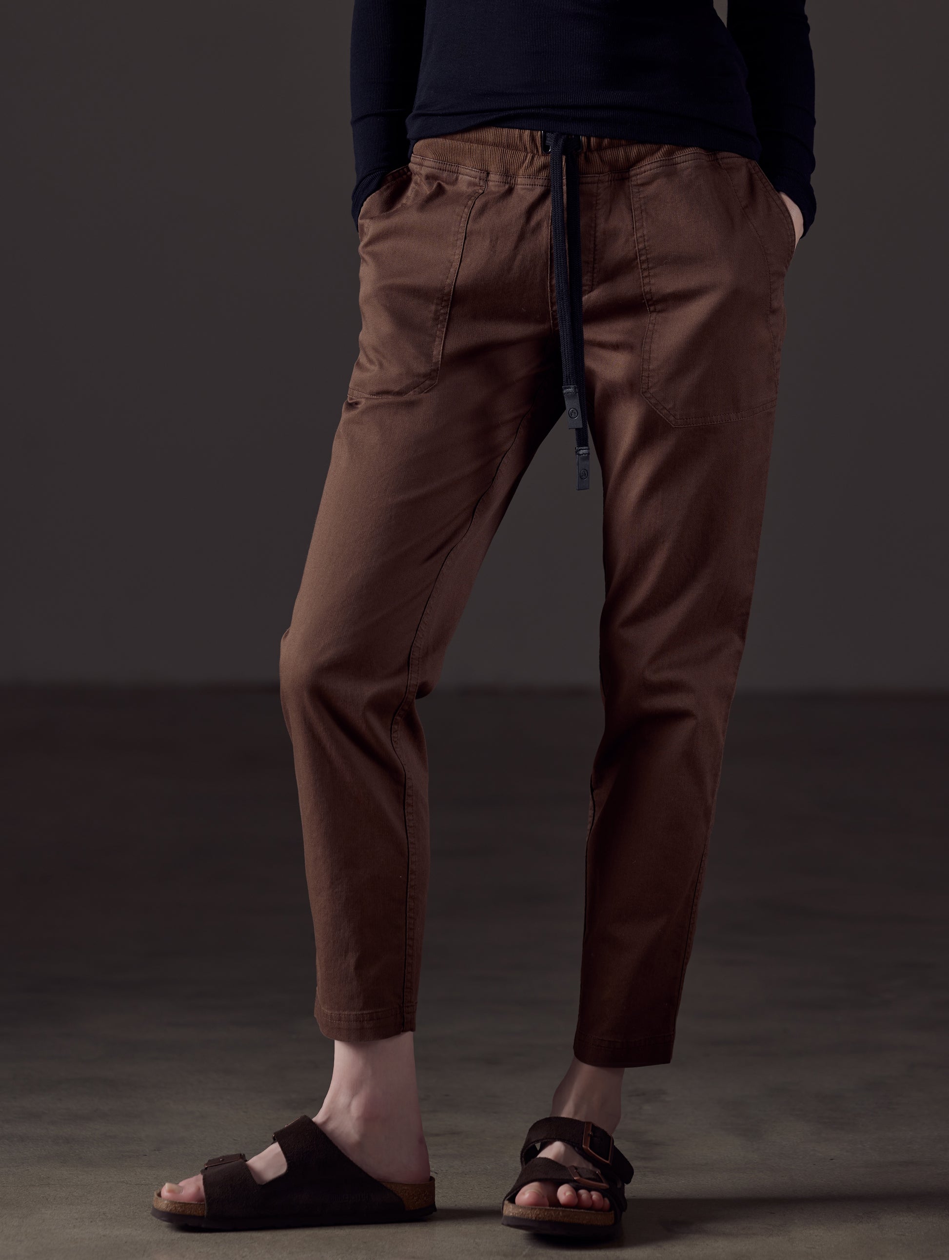 Woman wearing brown cotton pant from AETHER Apparel